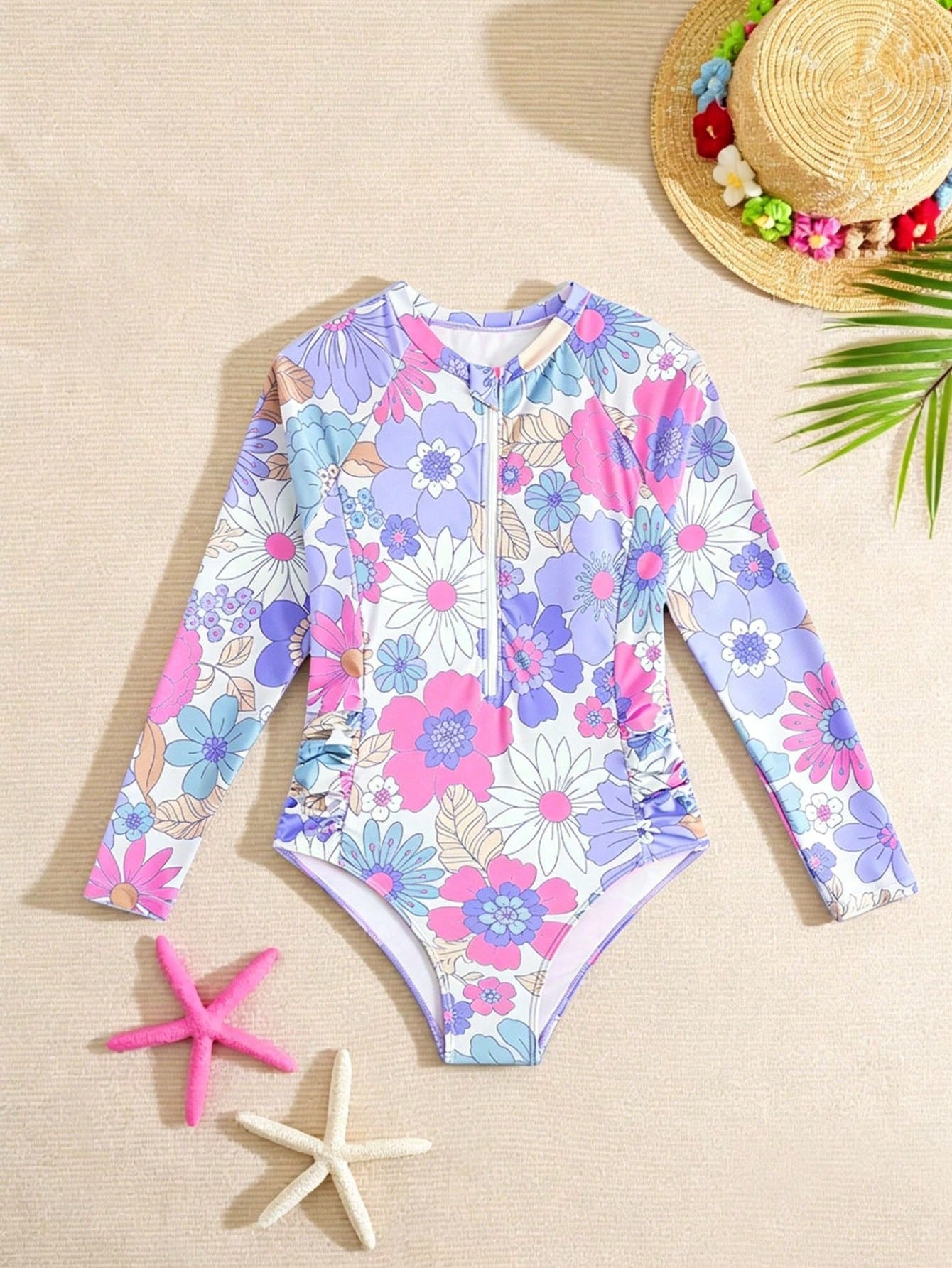 Purple floral one-piece swimsuit for tween girls with high neck, zipper detail, wireless bra design, and mid-waist bottom