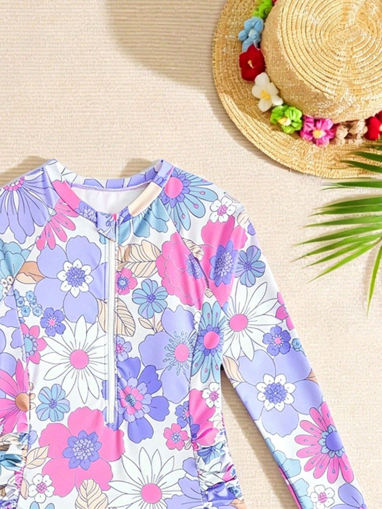 Purple floral one-piece swimsuit for tween girls with high neck, zipper detail, wireless bra design, and mid-waist bottom