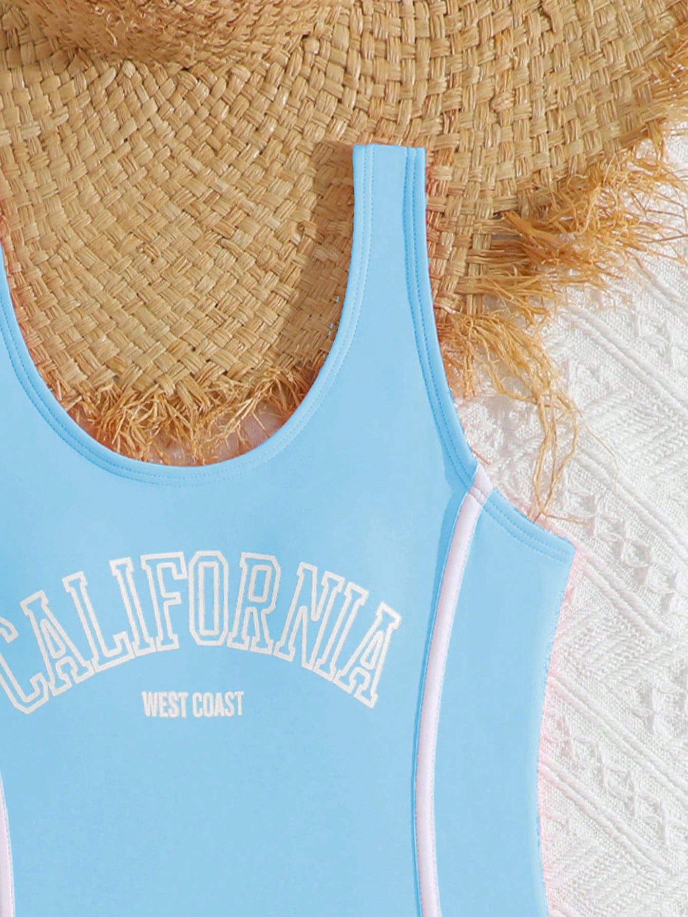 Girls baby blue striped 2-piece swimsuit set with sleeveless scoop neck one-piece, contrast piping, and matching swim shorts for beach and pool wear.
