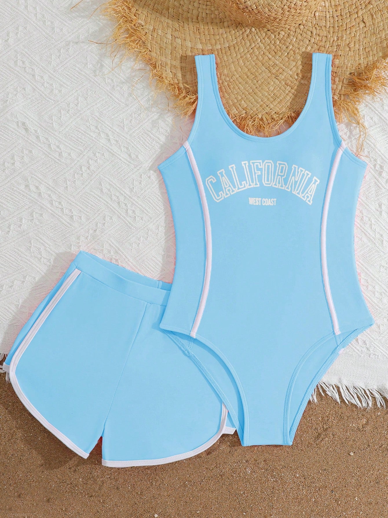 Girls baby blue striped 2-piece swimsuit set with sleeveless scoop neck one-piece, contrast piping, and matching swim shorts for beach and pool wear.