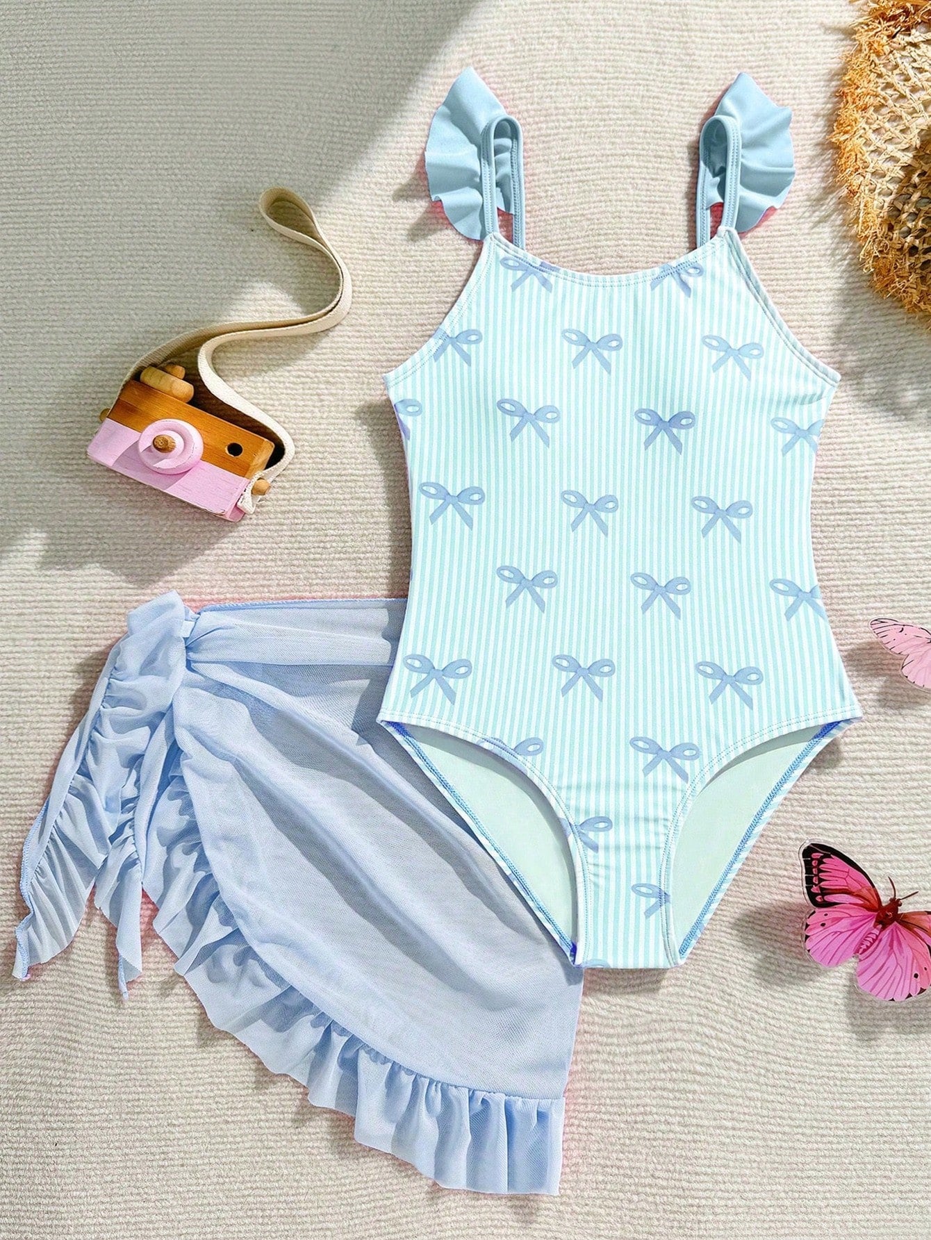 Tween girls one-piece swimsuit in leopard print with ruffle shoulder straps, scoop neckline, fitted shape, and attached ruffle hem skirt; sleeveless, mid-waist skirt bottom, and lined body for swimming, vacation, and summer beach wear.