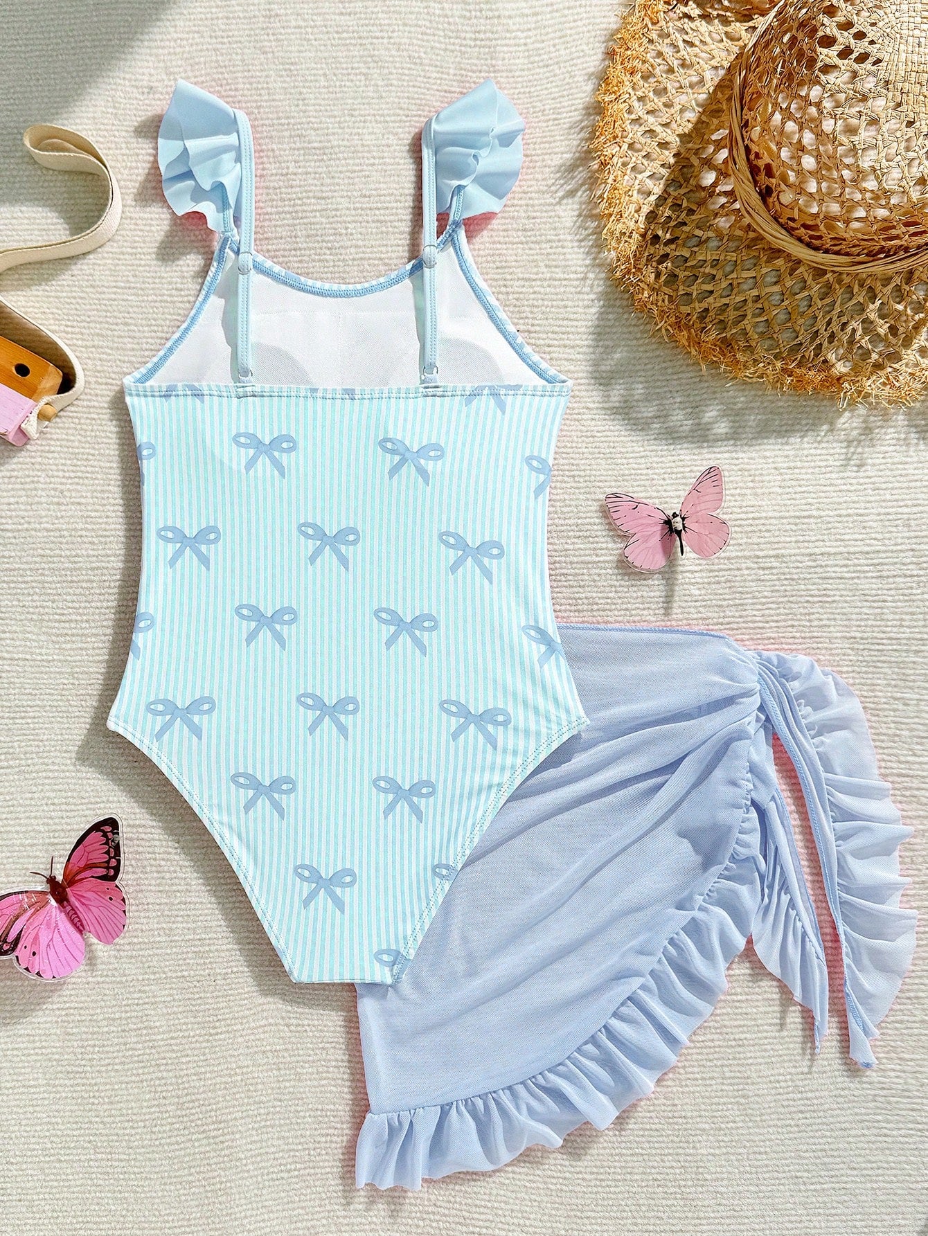 Tween girls one-piece swimsuit in leopard print with ruffle shoulder straps, scoop neckline, fitted shape, and attached ruffle hem skirt; sleeveless, mid-waist skirt bottom, and lined body for swimming, vacation, and summer beach wear.