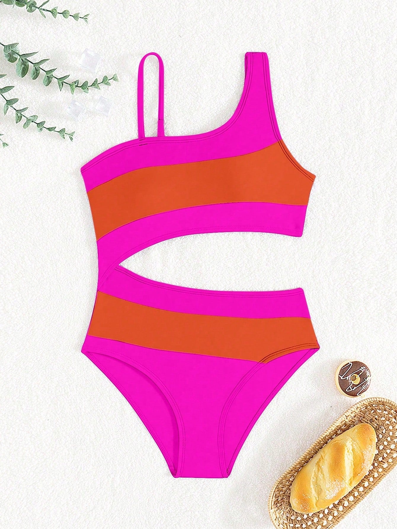 Black one-piece swimsuit for tween girls with cut out detail, spaghetti straps, high waist bottom, wireless bra, and fitted vacation swimwear style.