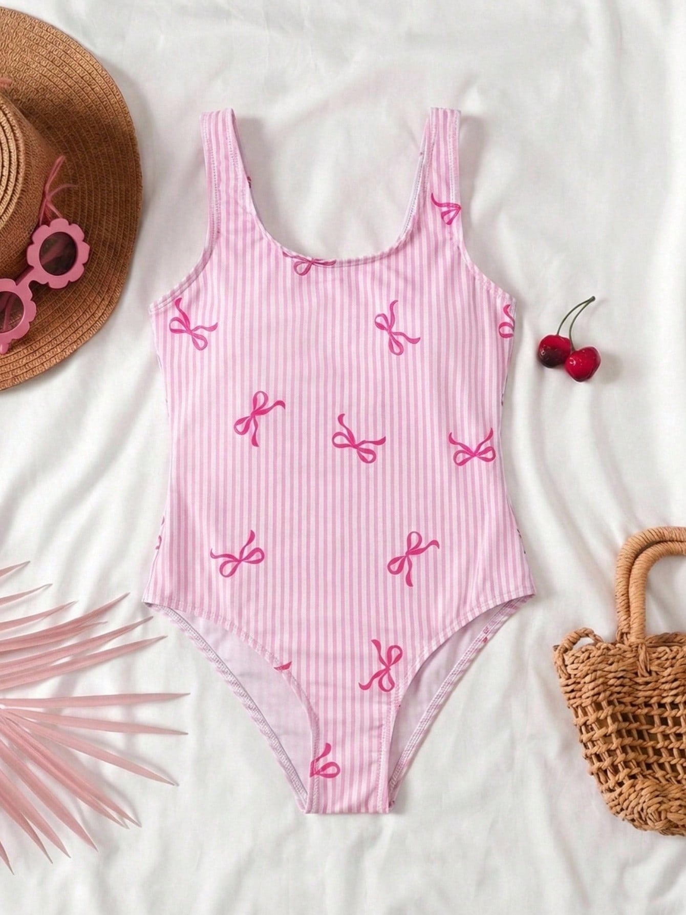 Tween girls multicolor floral one-piece swimsuit with tie shoulder straps, ruffle detail, short bottom, and vacation beach style