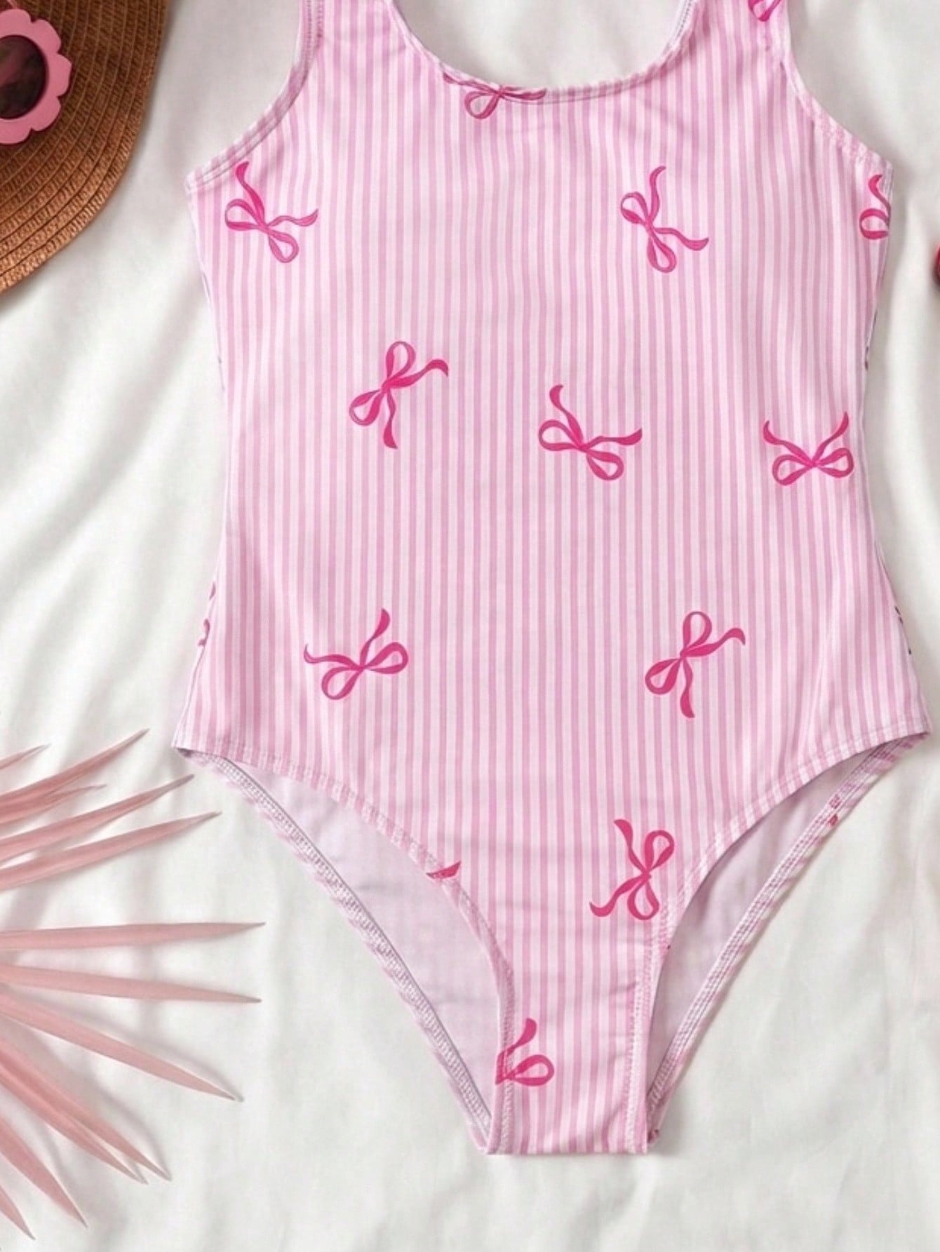Tween girls multicolor floral one-piece swimsuit with tie shoulder straps, ruffle detail, short bottom, and vacation beach style