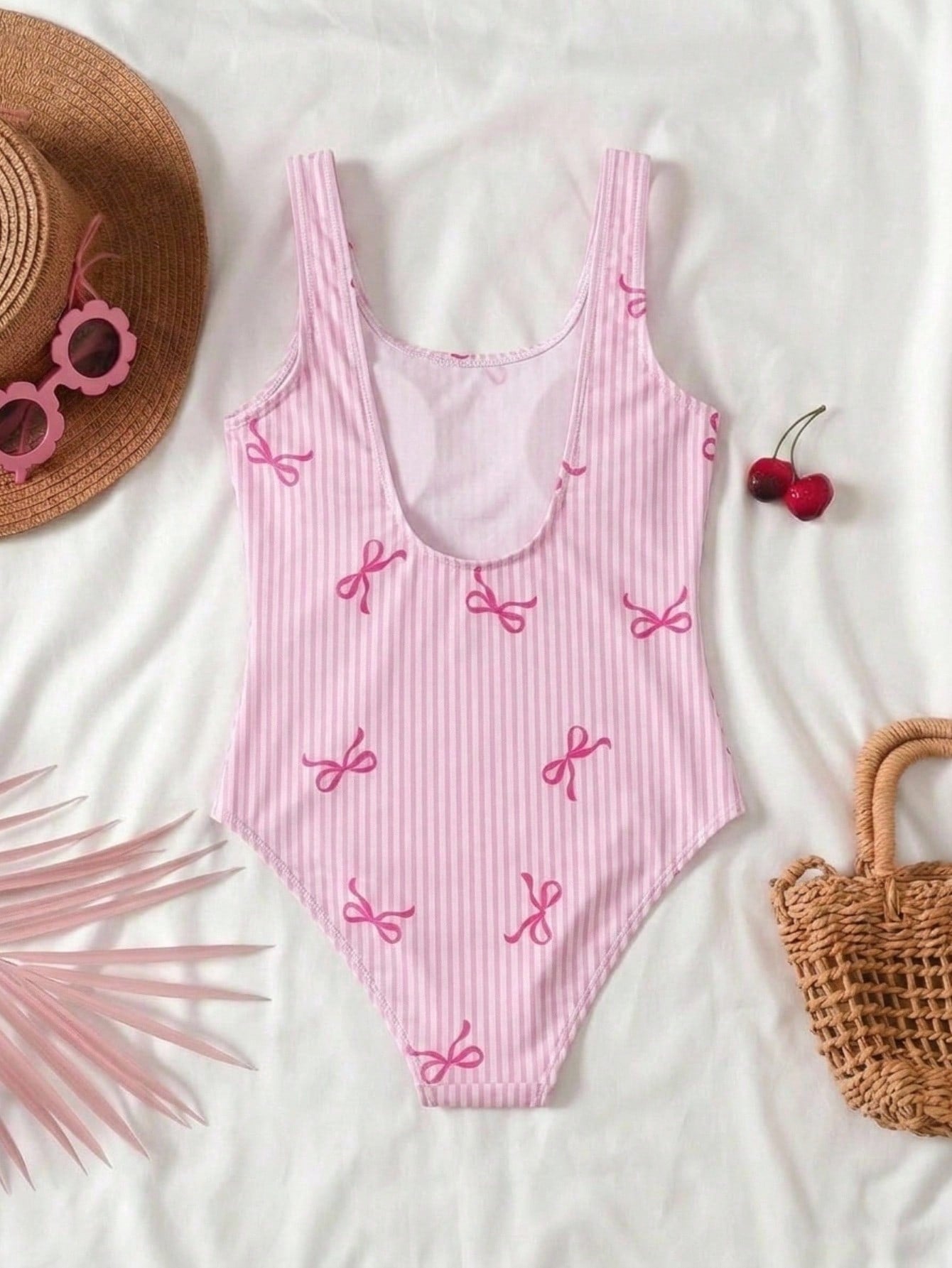Tween girls multicolor floral one-piece swimsuit with tie shoulder straps, ruffle detail, short bottom, and vacation beach style