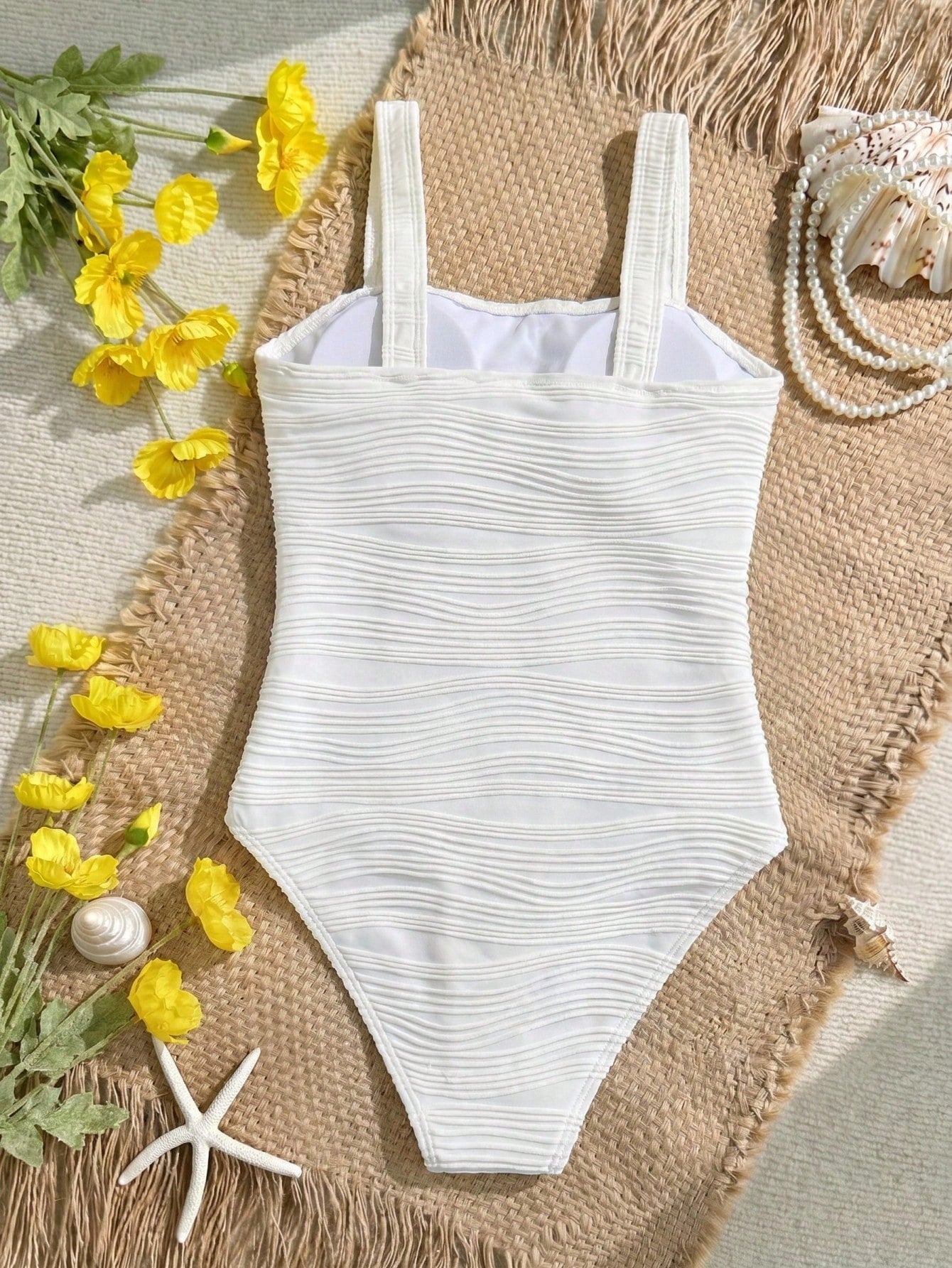 Apricot one-piece swimsuit for tween girls with strap neckline, contrast lace trim, fitted shape, mid-waist bottom, and lined body for beach or pool vacation wear.