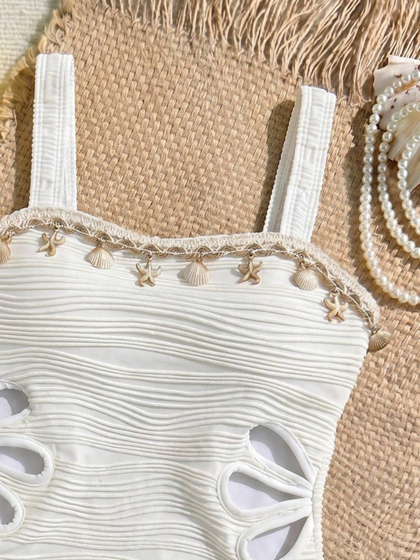 Apricot one-piece swimsuit for tween girls with strap neckline, contrast lace trim, fitted shape, mid-waist bottom, and lined body for beach or pool vacation wear.