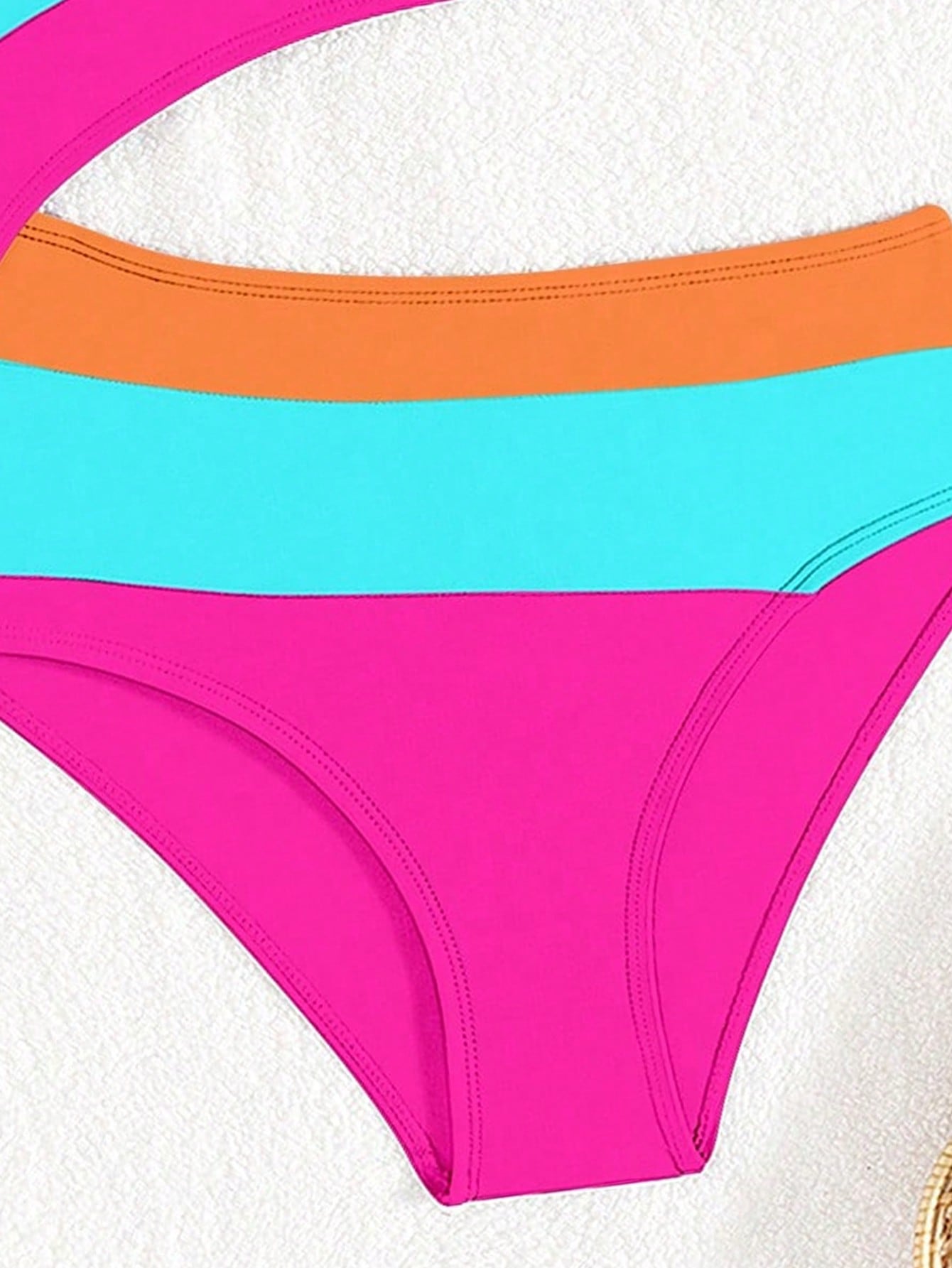 Black one-piece swimsuit for tween girls with cut out detail, spaghetti straps, high waist bottom, wireless bra, and fitted vacation swimwear style.