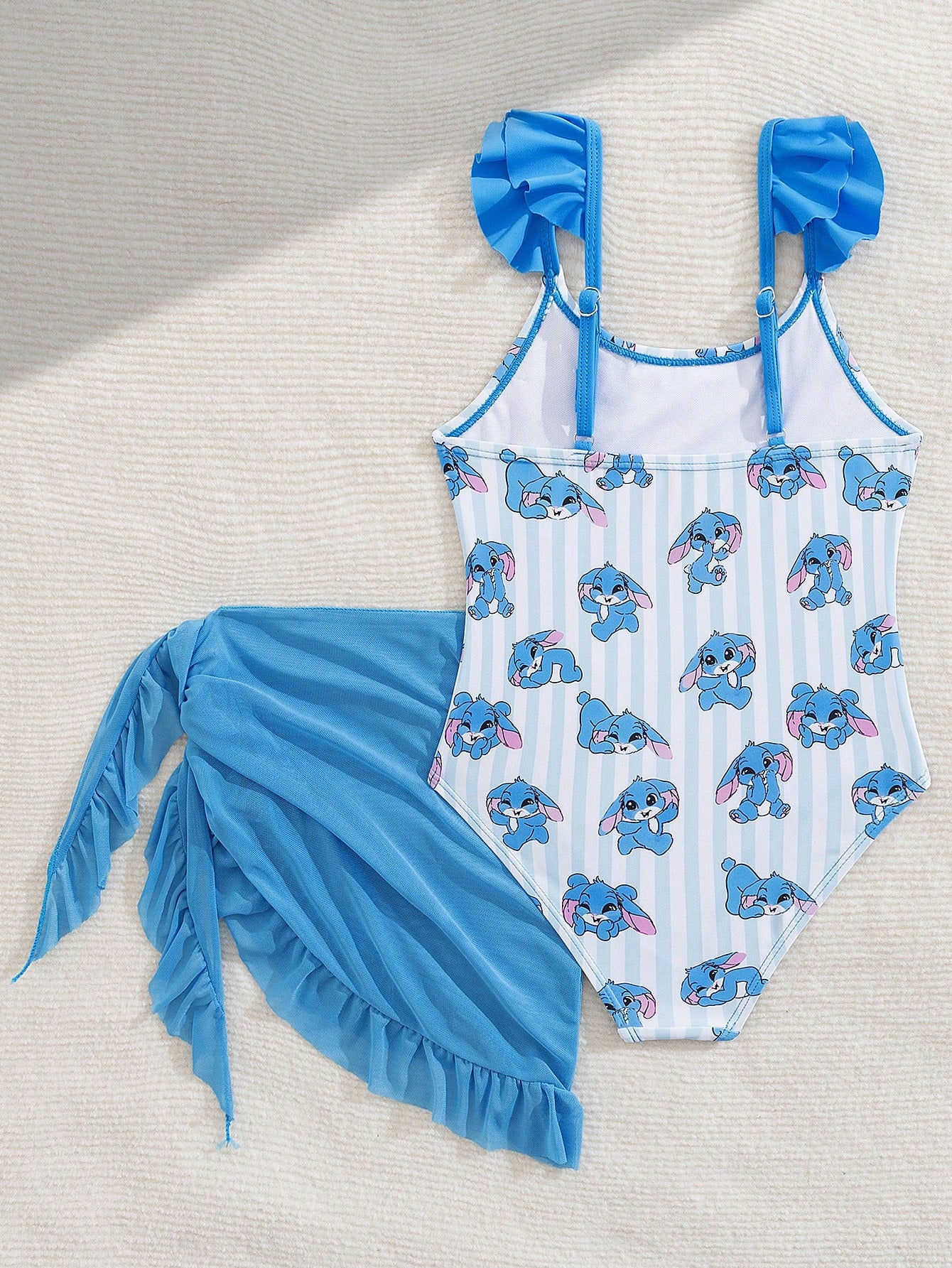 Tween girls one-piece swimsuit in leopard print with ruffle shoulder straps, scoop neckline, fitted shape, and attached ruffle hem skirt; sleeveless, mid-waist skirt bottom, and lined body for swimming, vacation, and summer beach wear.