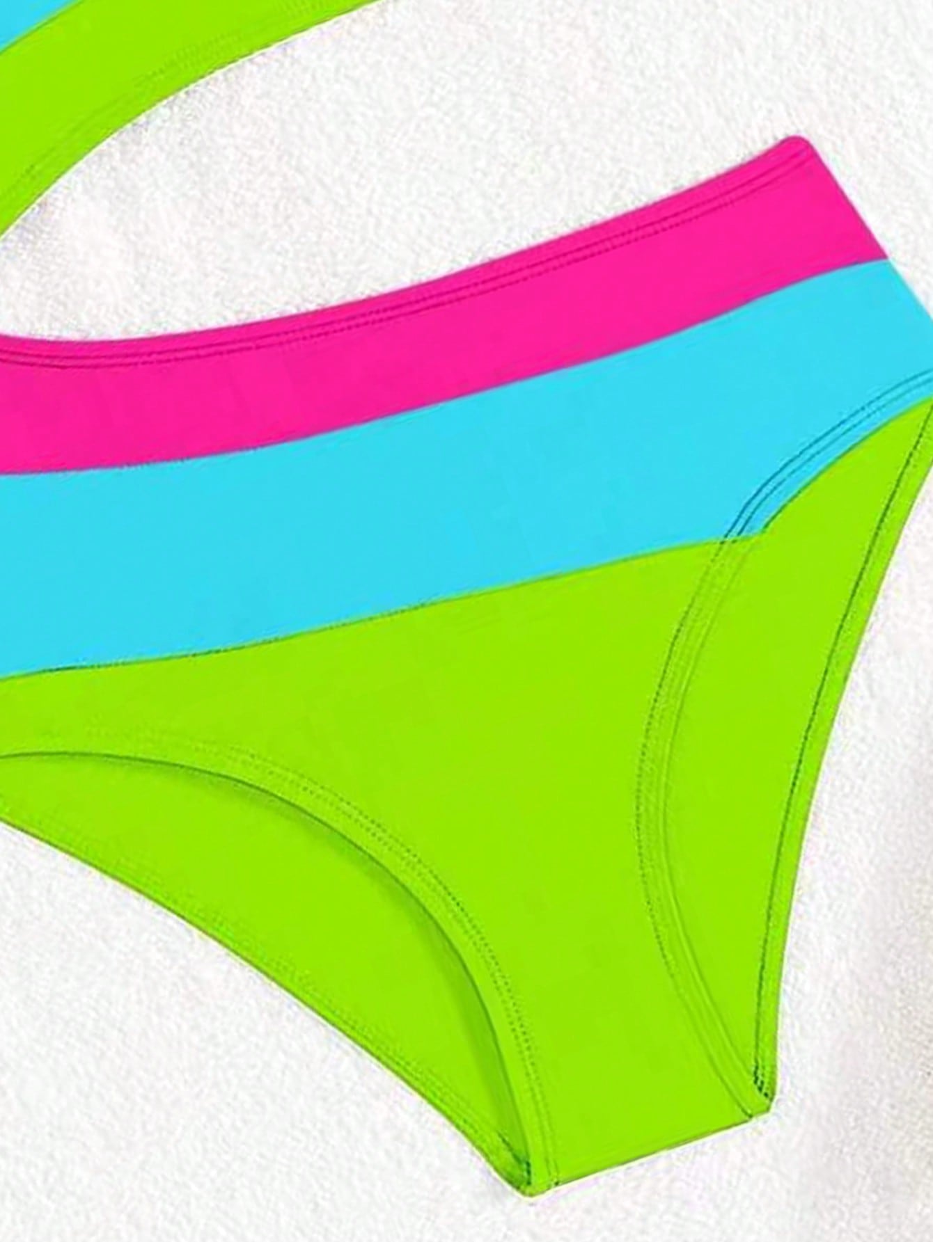 Black one-piece swimsuit for tween girls with cut out detail, spaghetti straps, high waist bottom, wireless bra, and fitted vacation swimwear style.