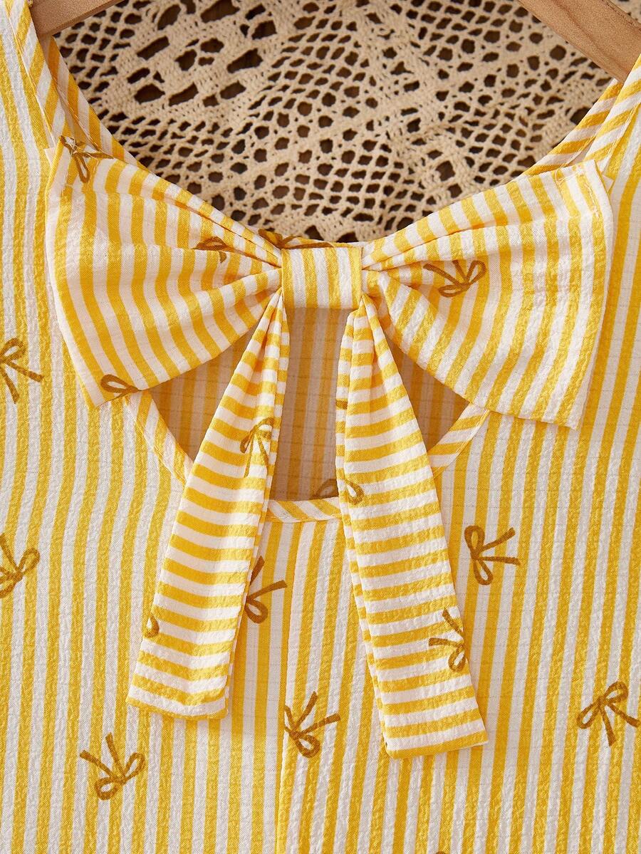 Tween girls apricot vacation midi dress featuring a round neck, cut out details, ruffle flounce accents, and geometric pattern.