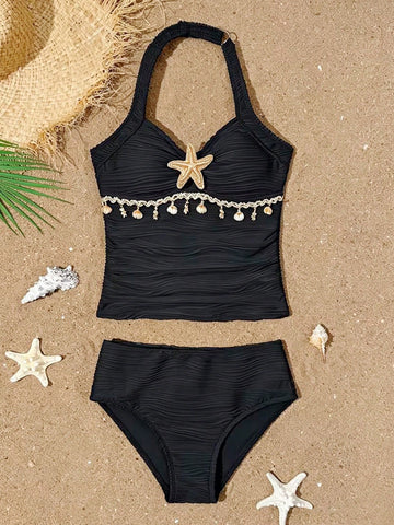 Tween girls 2-piece bikini swimwear set in black with a wave-pattern geometric design, featuring halter neckline, wireless top, and high-waist short bottoms with starfish and shell decor.