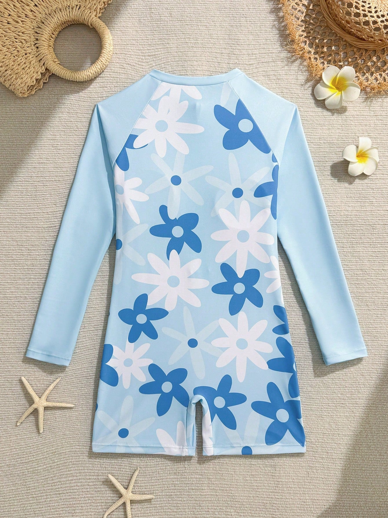 Tween girls one-piece swimsuit featuring a high neck, long sleeves, and shorts bottom, with a back zipper and strawberry plaid digital print on stretch knit fabric. Designed for swimming, vacation, and summer wear.