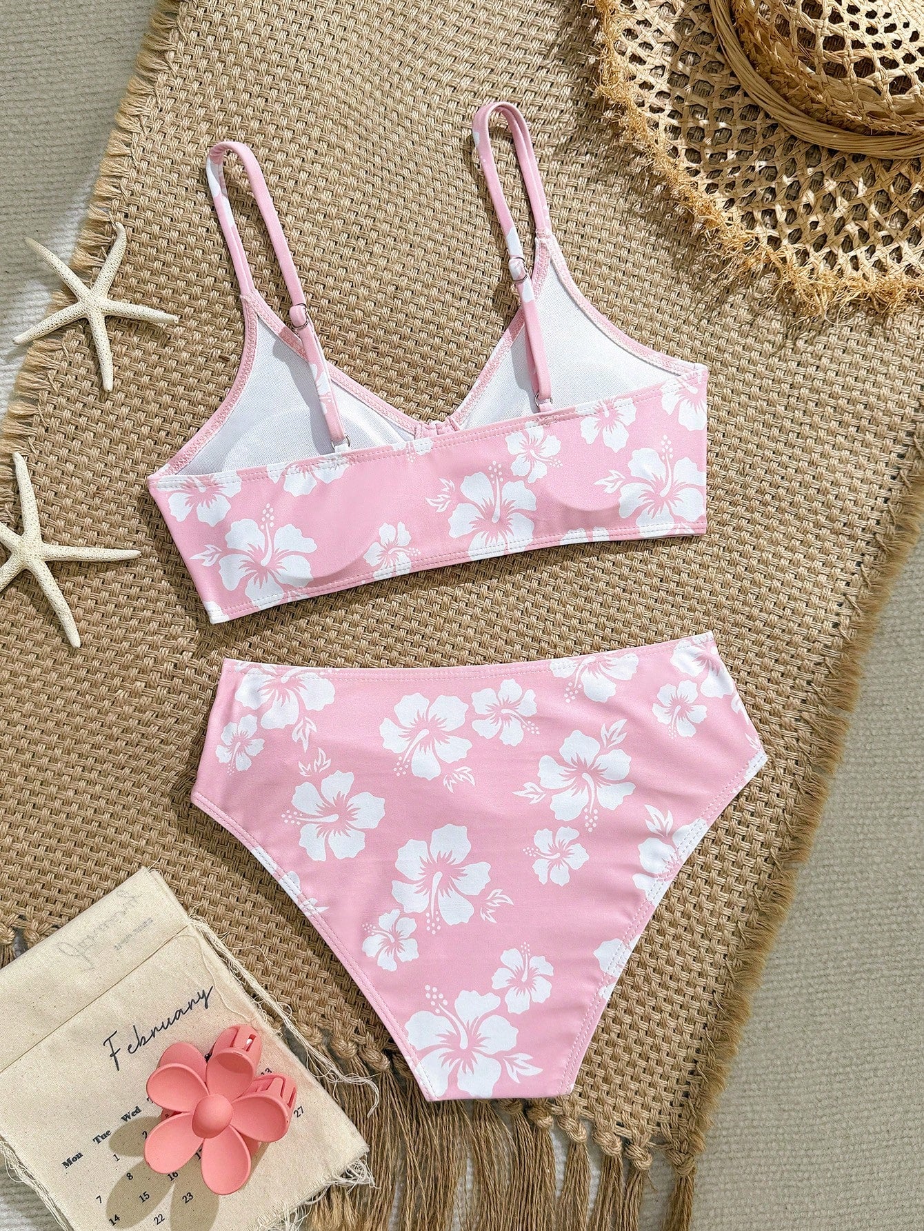 Tween girls 2-piece ditsy floral bikini set featuring a spaghetti strap top with center string detail and matching bottoms with side strings, designed for swimming, vacation, and summer wear.