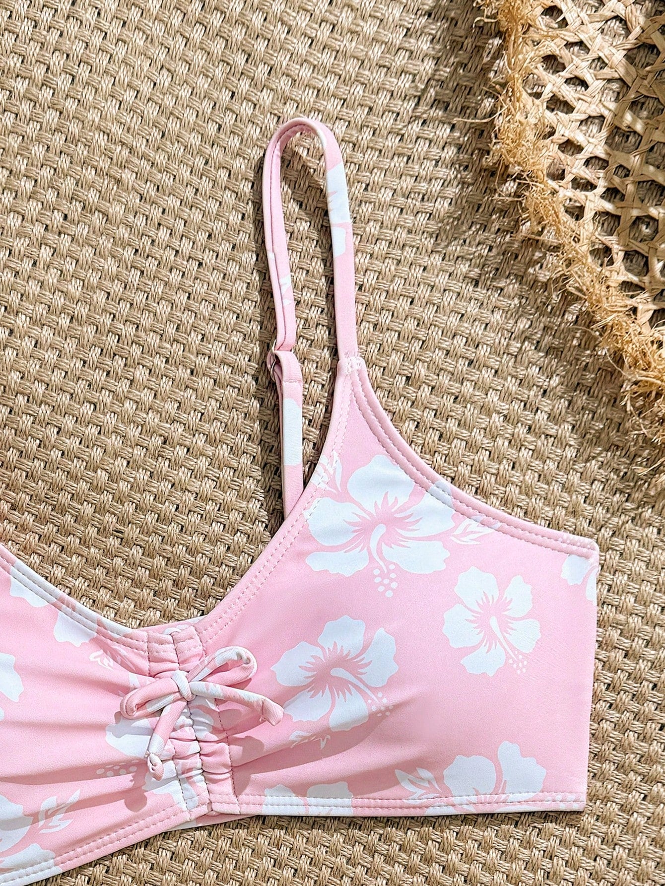 Tween girls 2-piece ditsy floral bikini set featuring a spaghetti strap top with center string detail and matching bottoms with side strings, designed for swimming, vacation, and summer wear.