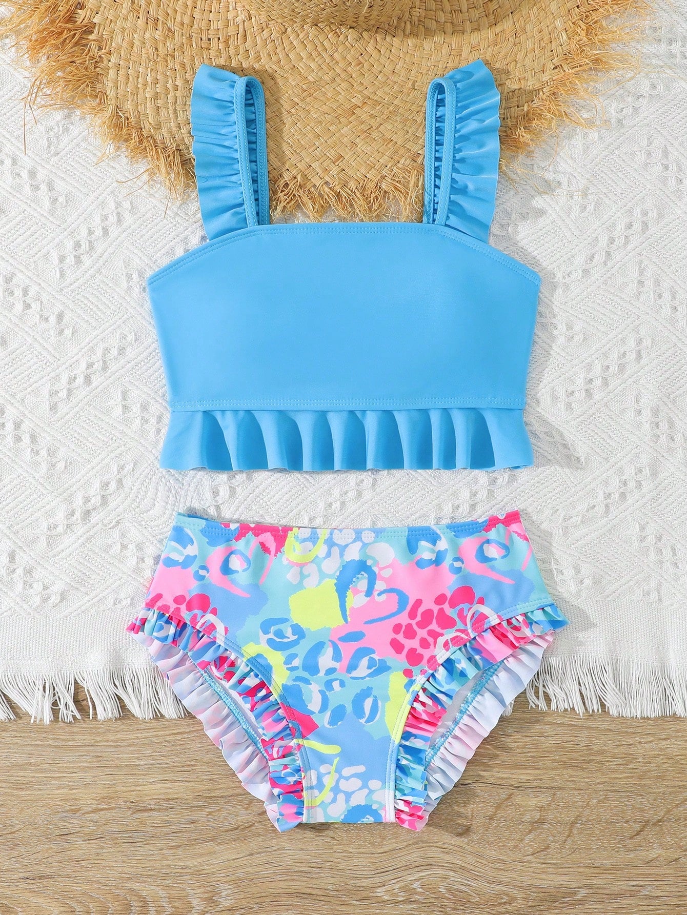 Tween girls solid color 2-piece bikini swimwear set with ruffle detail, strap neckline, wireless bikini top, and triangle mid-waist bikini bottoms; textured pattern with lined bottoms and high-stretch fabric, suitable for summer vacation.