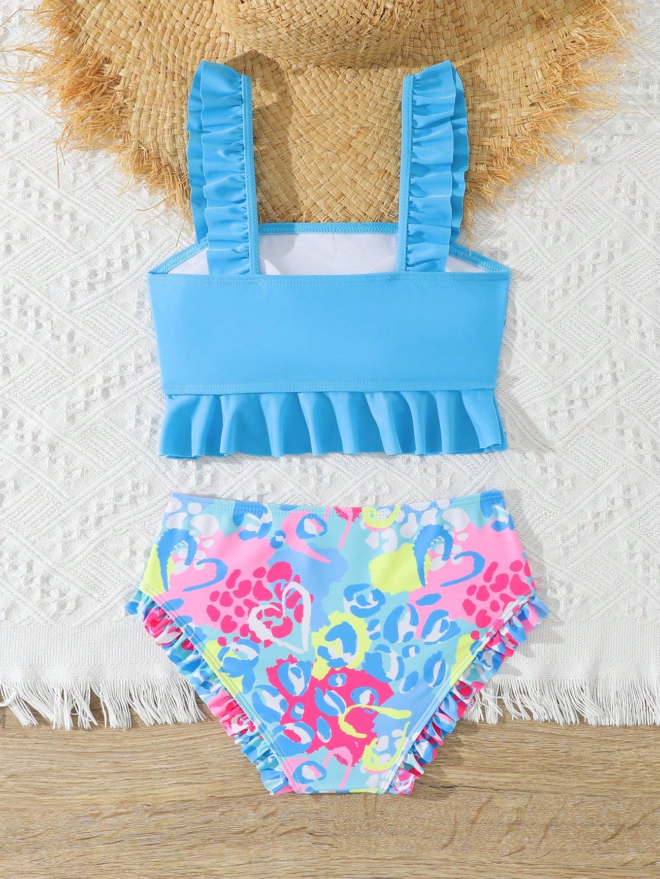 Tween girls solid color 2-piece bikini swimwear set with ruffle detail, strap neckline, wireless bikini top, and triangle mid-waist bikini bottoms; textured pattern with lined bottoms and high-stretch fabric, suitable for summer vacation.