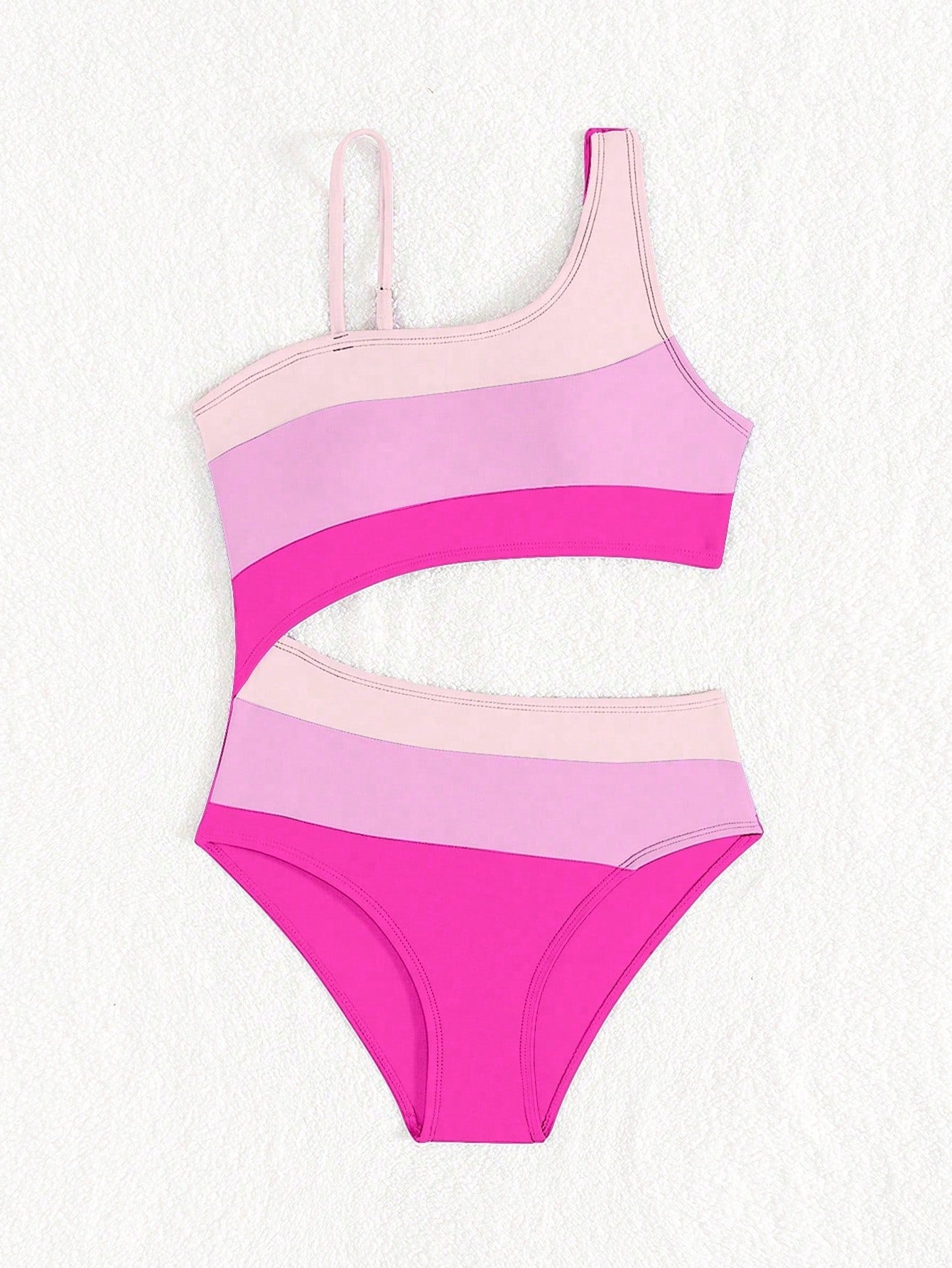Black one-piece swimsuit for tween girls with cut out detail, spaghetti straps, high waist bottom, wireless bra, and fitted vacation swimwear style.