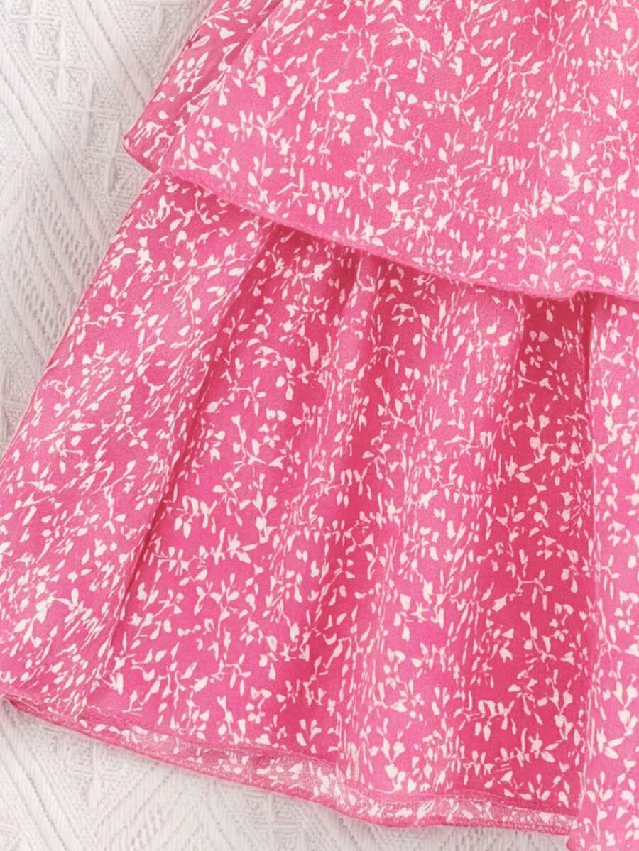 Tween girls blue and white 2-piece set with a striped halter neck vest top and a floral high-waist tiered paperbag skirt.