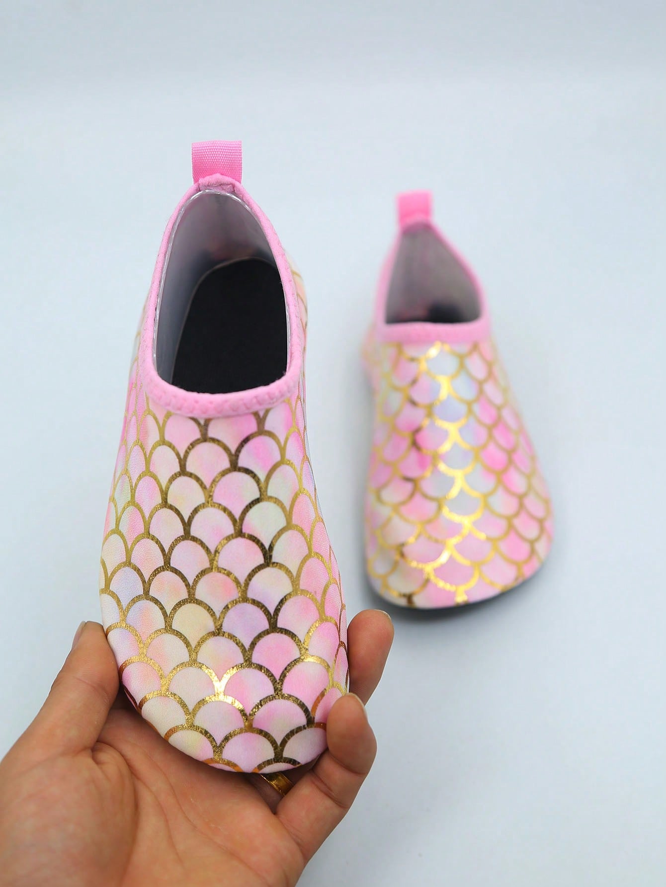 Multicolor kids slip-on water shoes with breathable Lycra upper and non-slip TPR outsole for boys and girls.