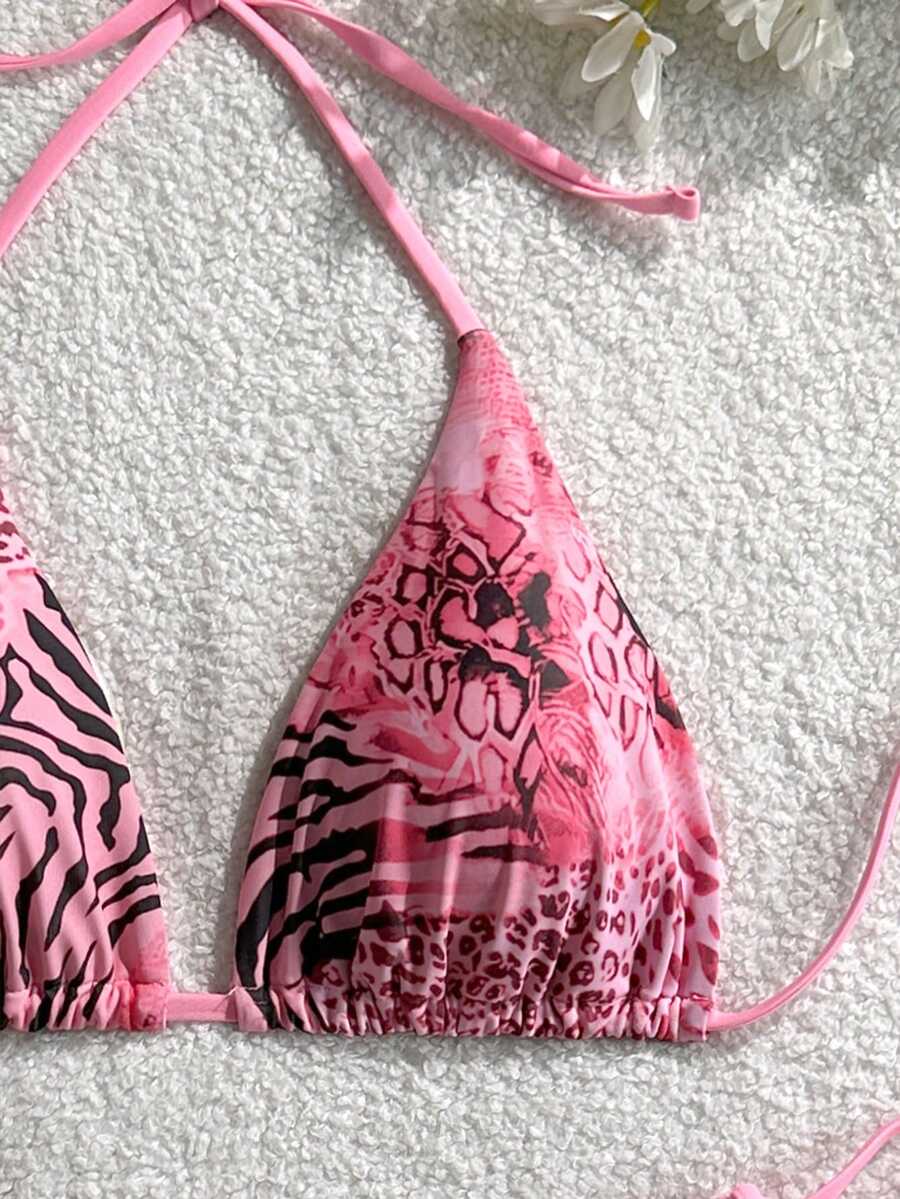 Women's vintage leopard print 2-piece bikini set featuring a high waist tie-side bottom and a halter neck triangle top.
