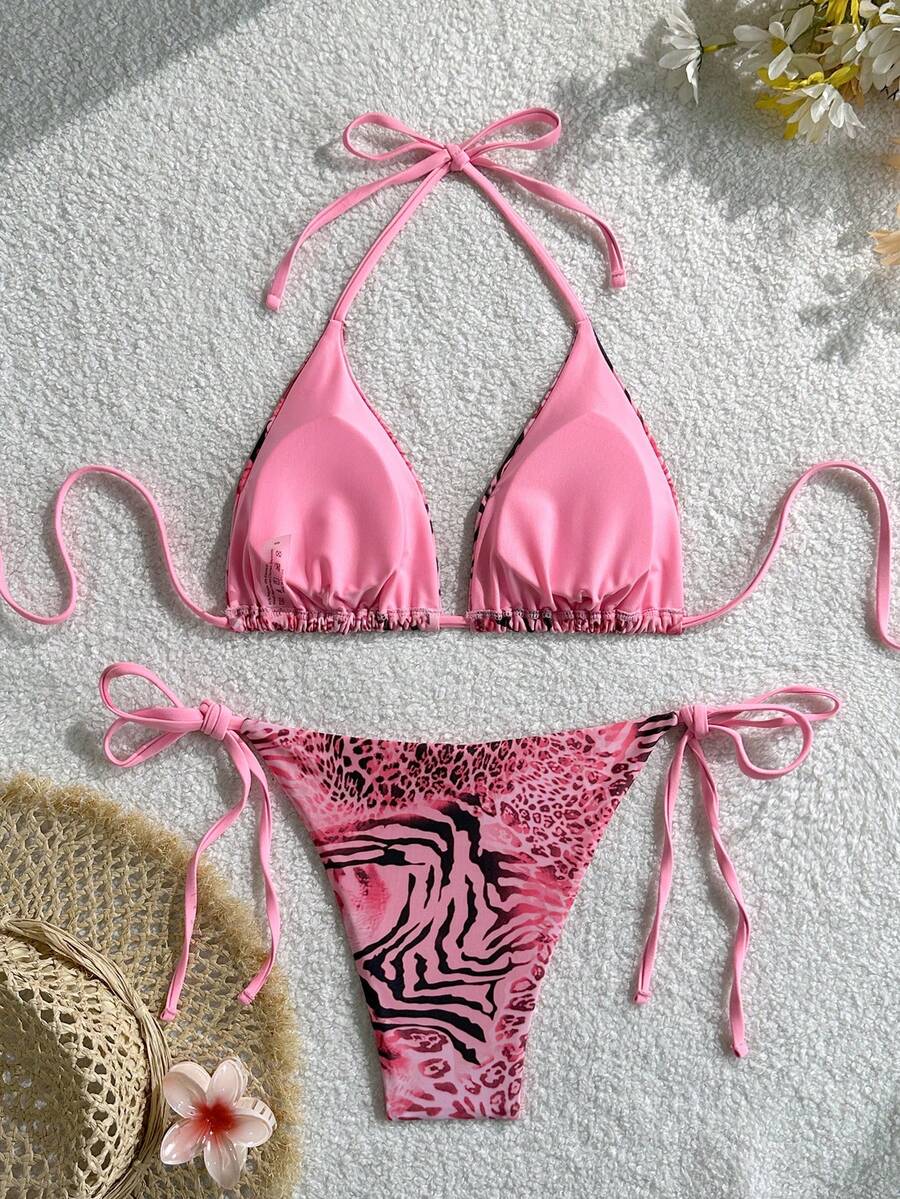 Women's vintage leopard print 2-piece bikini set featuring a high waist tie-side bottom and a halter neck triangle top.