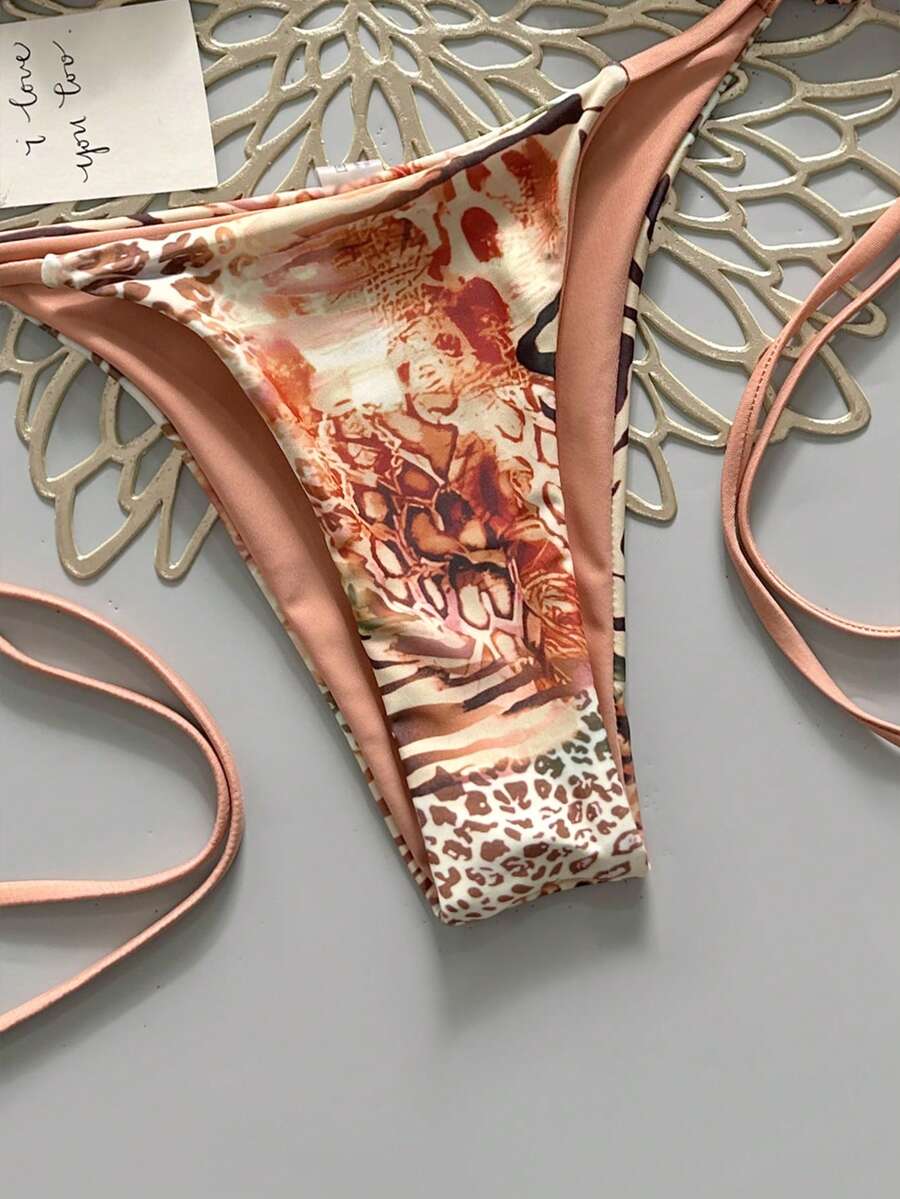 Women's vintage leopard print 2-piece bikini set featuring a high waist tie-side bottom and a halter neck triangle top.
