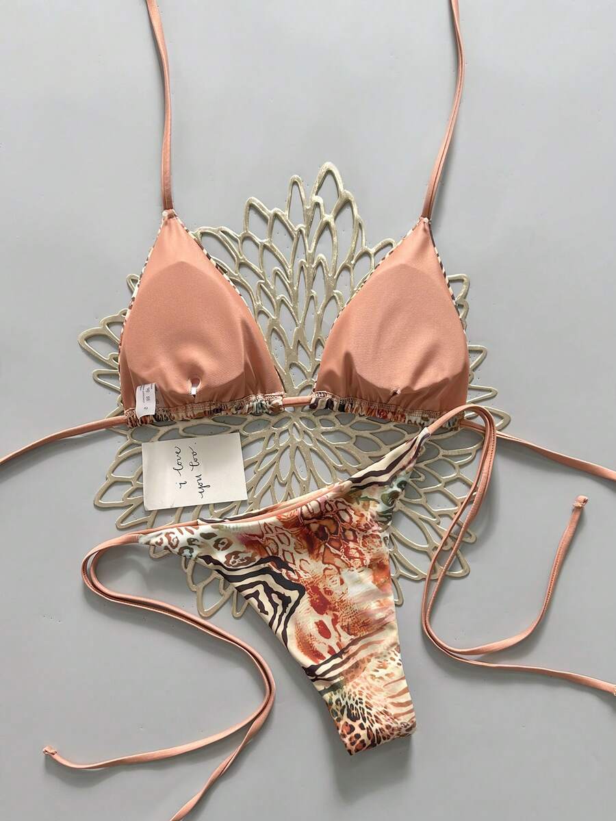 Women's vintage leopard print 2-piece bikini set featuring a high waist tie-side bottom and a halter neck triangle top.