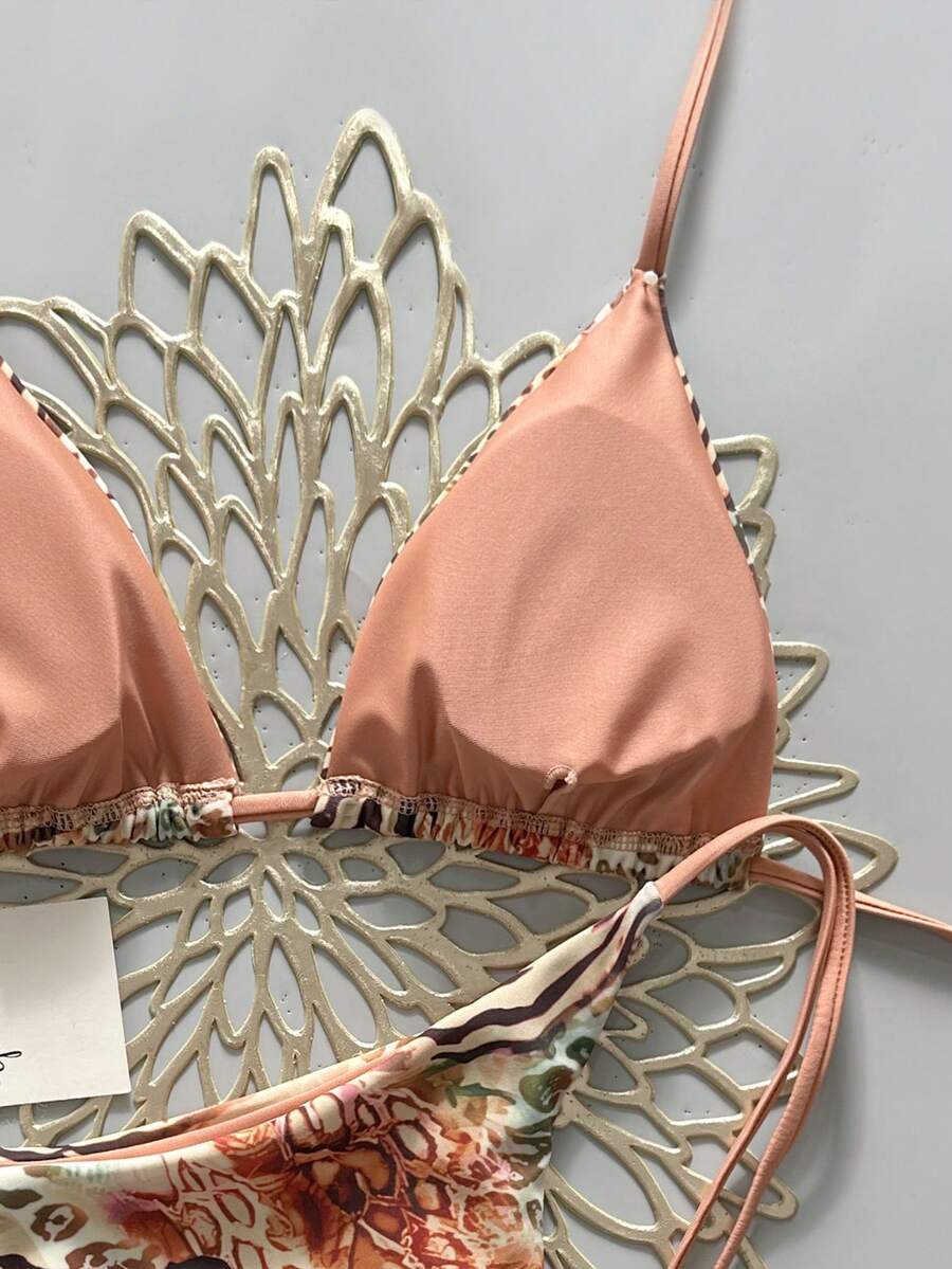 Women's vintage leopard print 2-piece bikini set featuring a high waist tie-side bottom and a halter neck triangle top.