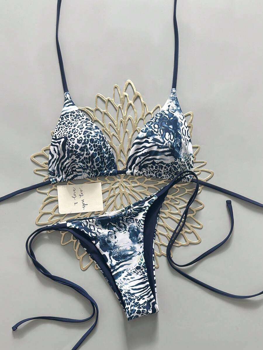 Women's vintage leopard print 2-piece bikini set featuring a high waist tie-side bottom and a halter neck triangle top.