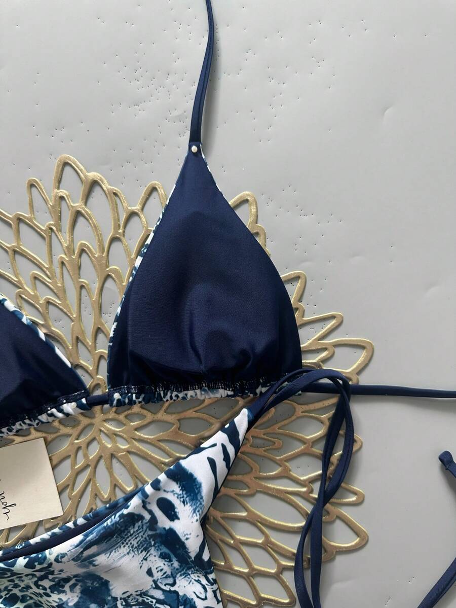 Women's vintage leopard print 2-piece bikini set featuring a high waist tie-side bottom and a halter neck triangle top.