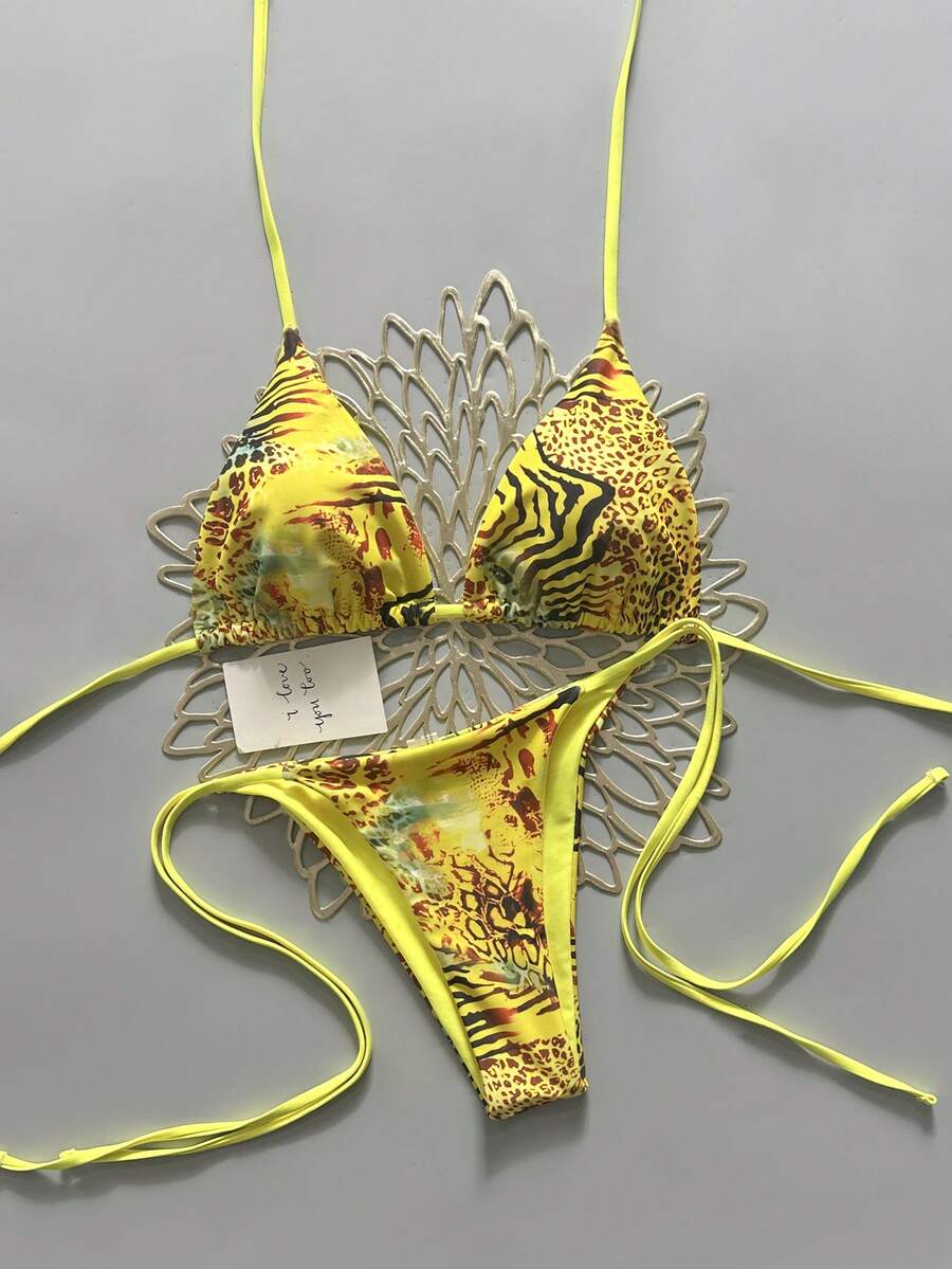 Women's vintage leopard print 2-piece bikini set featuring a high waist tie-side bottom and a halter neck triangle top.