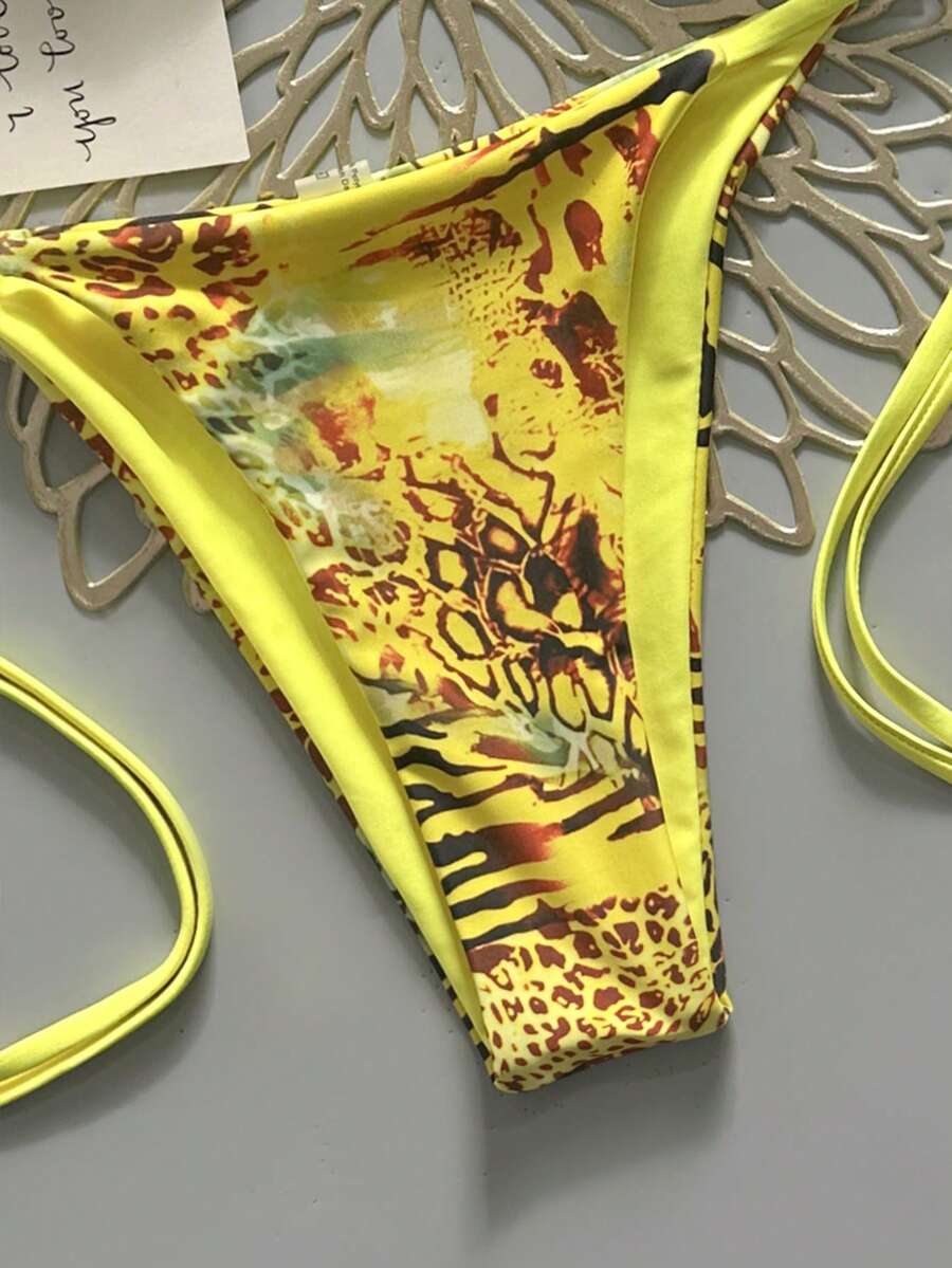 Women's vintage leopard print 2-piece bikini set featuring a high waist tie-side bottom and a halter neck triangle top.