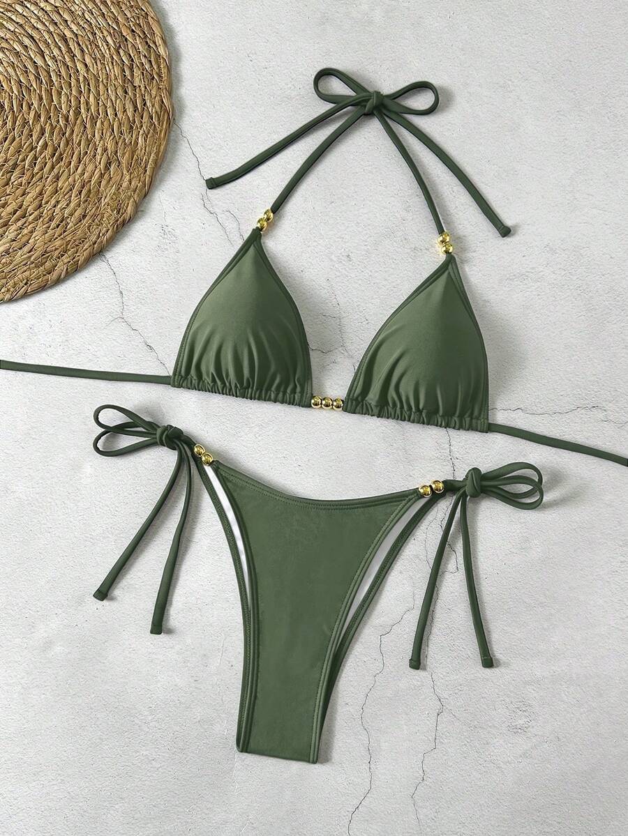 Women's black halter bikini set featuring triangle cups with gold bead decor and tie-back closure