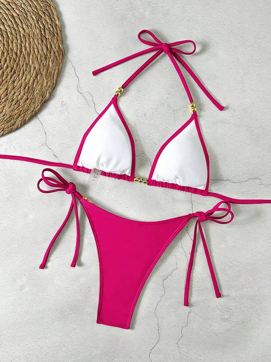 Women's black halter bikini set featuring triangle cups with gold bead decor and tie-back closure