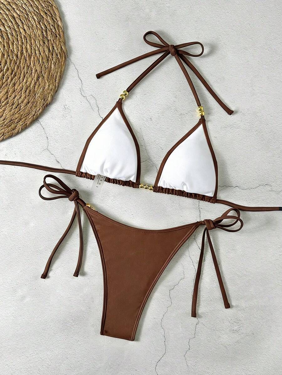 Women's black halter bikini set featuring triangle cups with gold bead decor and tie-back closure