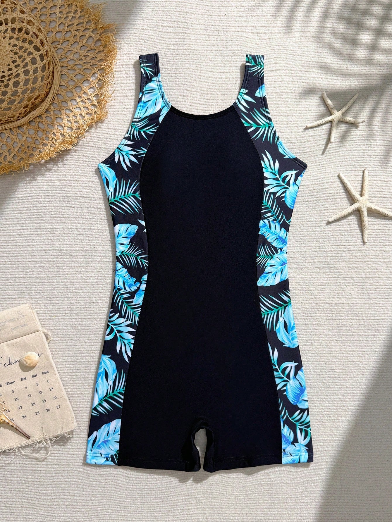 Tween girls one-piece swimsuit with scoop neck, contrast piping, short length, and shorts bottom for summer beach and vacation wear