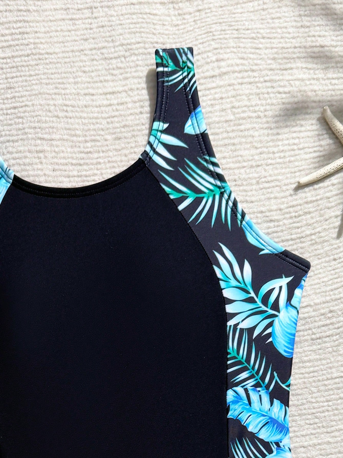 Tween girls one-piece swimsuit with scoop neck, contrast piping, short length, and shorts bottom for summer beach and vacation wear