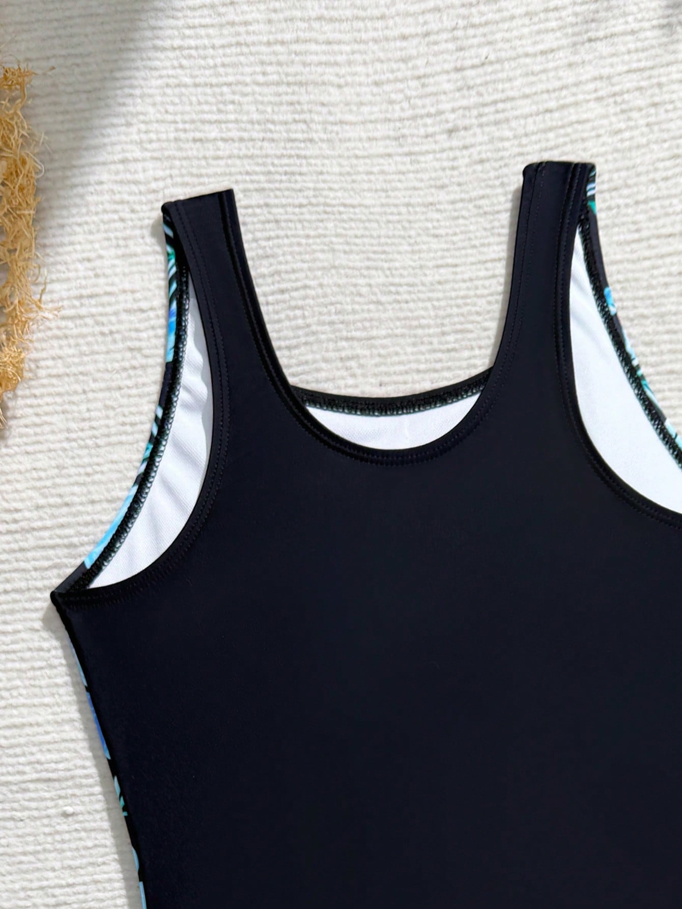 Tween girls one-piece swimsuit with scoop neck, contrast piping, short length, and shorts bottom for summer beach and vacation wear