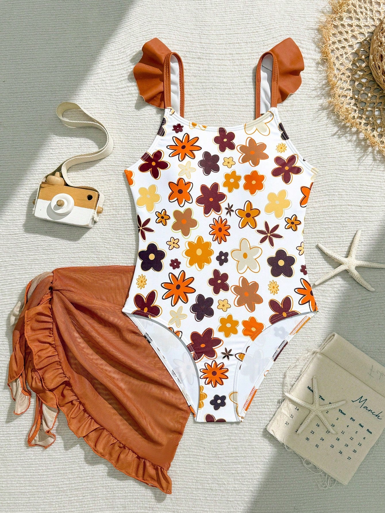 Tween girls one-piece swimsuit in leopard print with ruffle shoulder straps, scoop neckline, fitted shape, and attached ruffle hem skirt; sleeveless, mid-waist skirt bottom, and lined body for swimming, vacation, and summer beach wear.