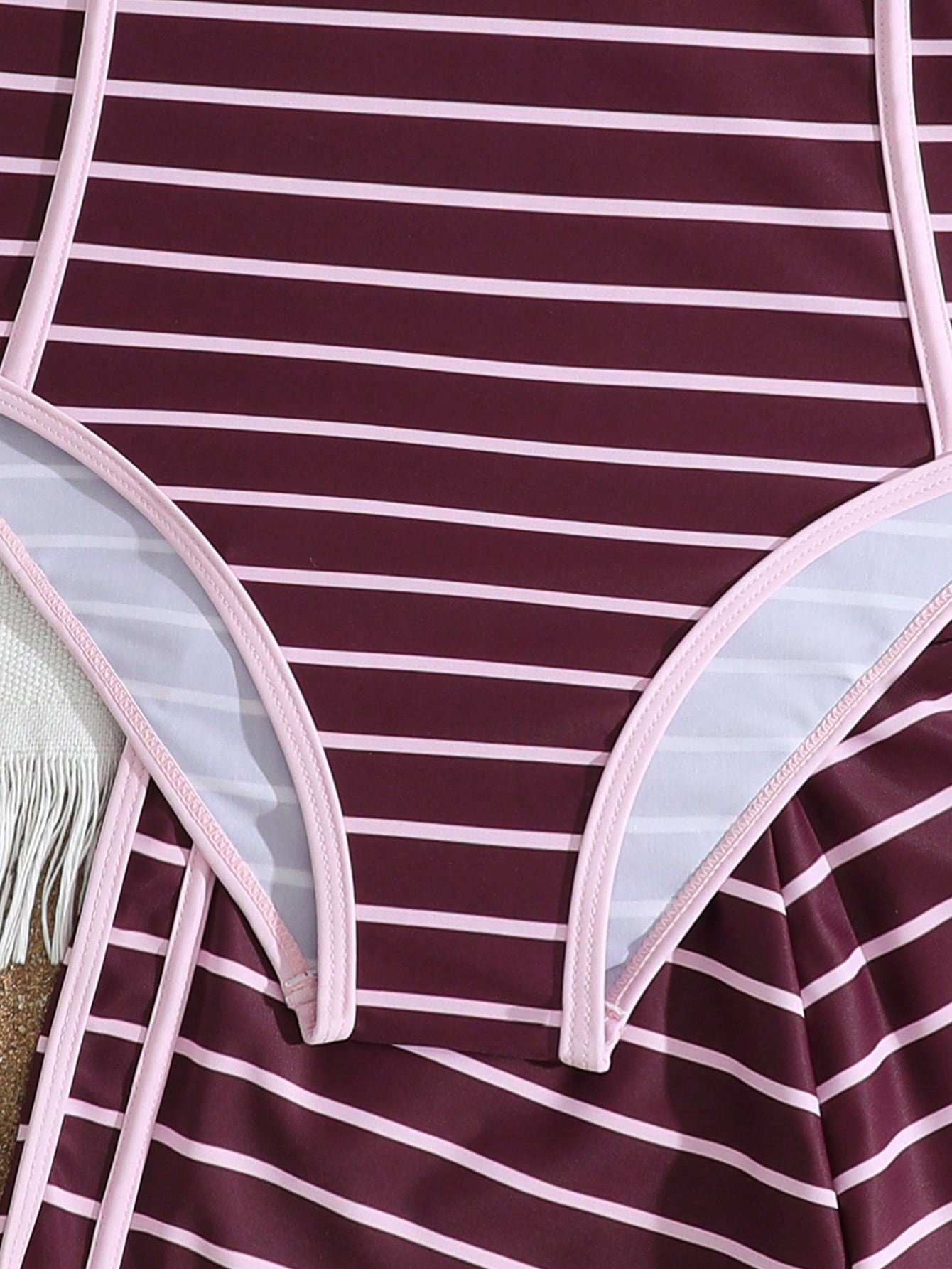 Girls' mauve purple one-piece swimsuit with swim shorts, spaghetti straps, contrast piping, letter pattern, and sleeveless vacation swimwear design.