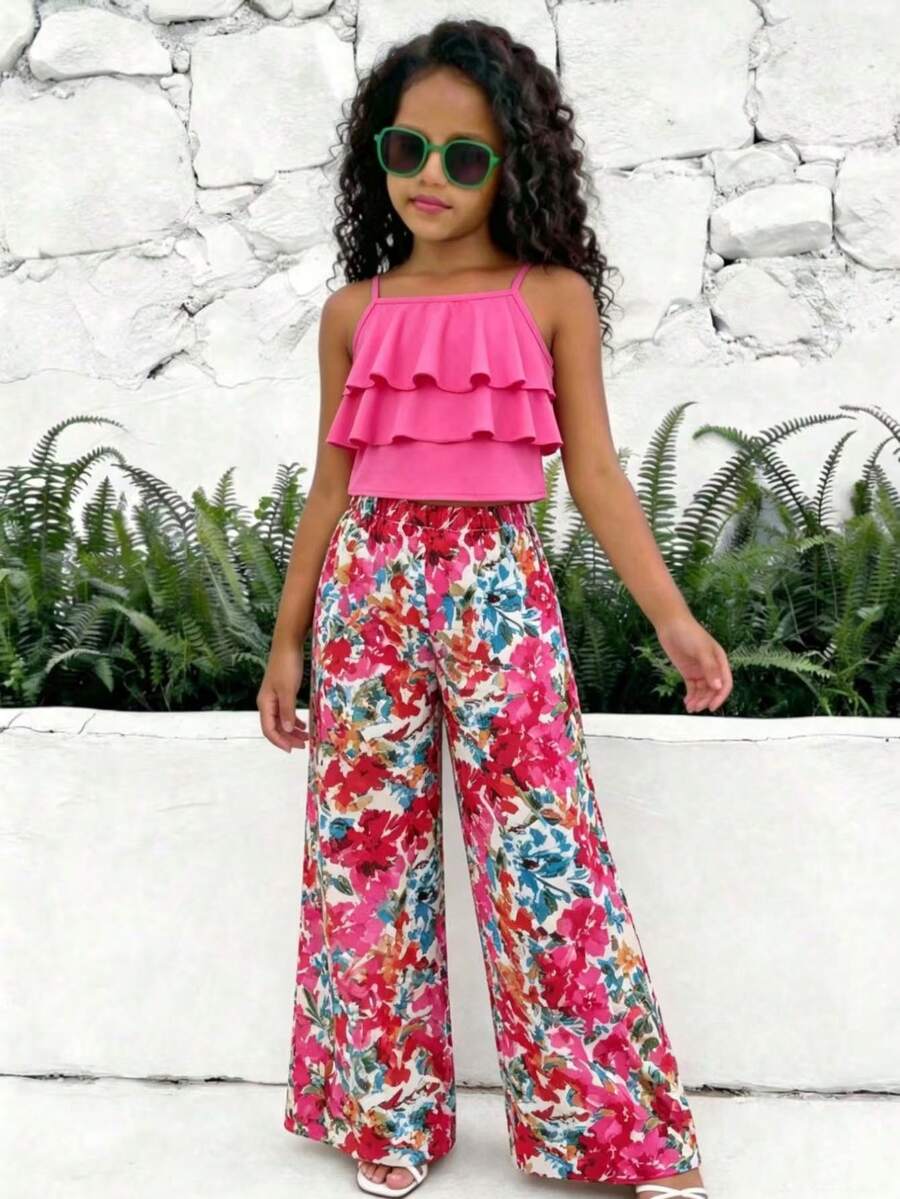 Tween girls blue 2-piece vacation outfit set featuring a tiered ruffle spaghetti strap camisole and loose high-waist pants.