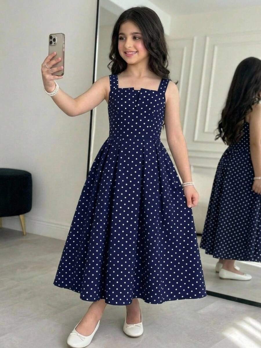 Tween girl apricot floral print midi dress with ruffle shoulder straps, shirred detail, and high waist A-line fit.