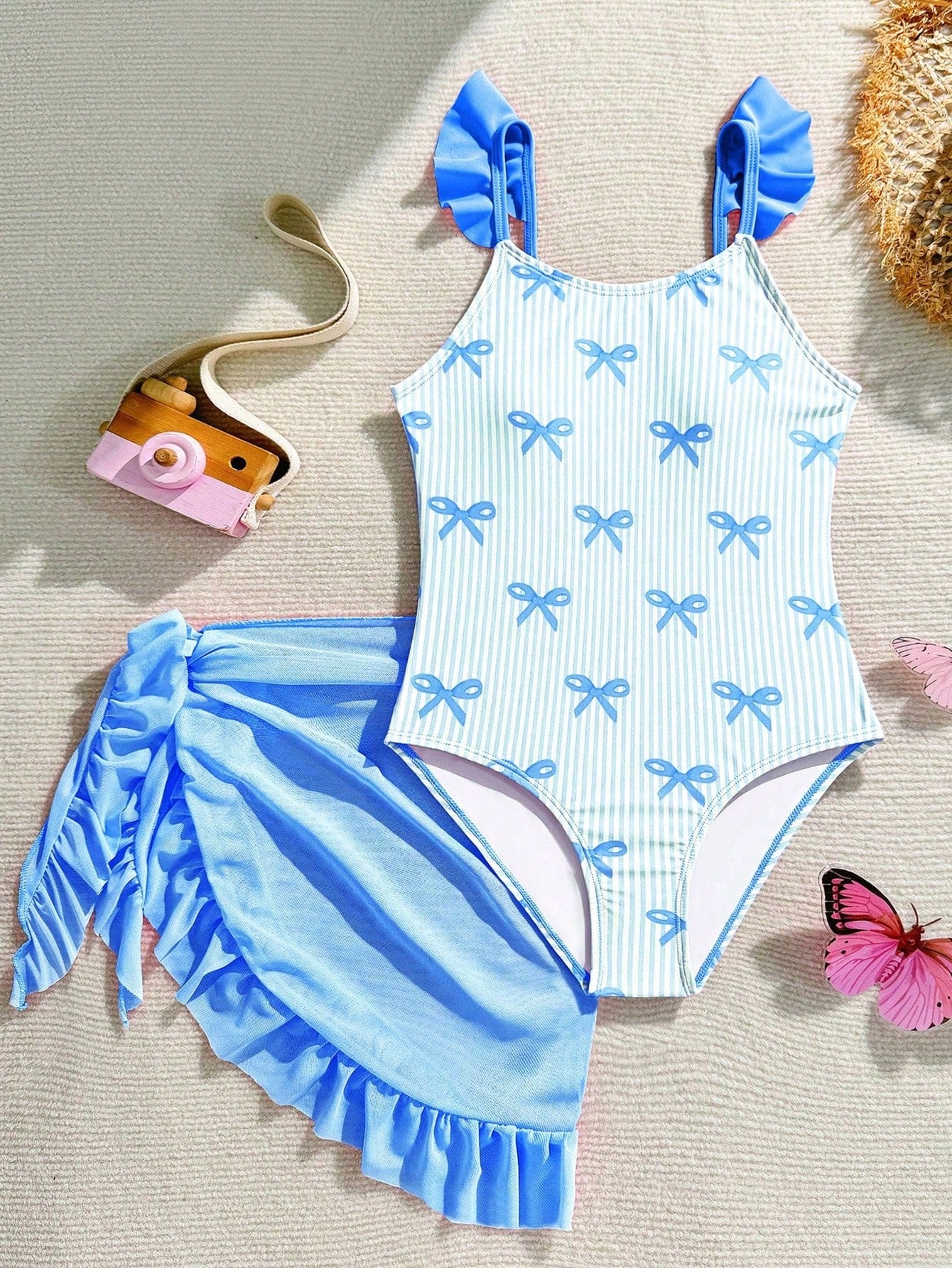 Tween girls one-piece swimsuit in leopard print with ruffle shoulder straps, scoop neckline, fitted shape, and attached ruffle hem skirt; sleeveless, mid-waist skirt bottom, and lined body for swimming, vacation, and summer beach wear.