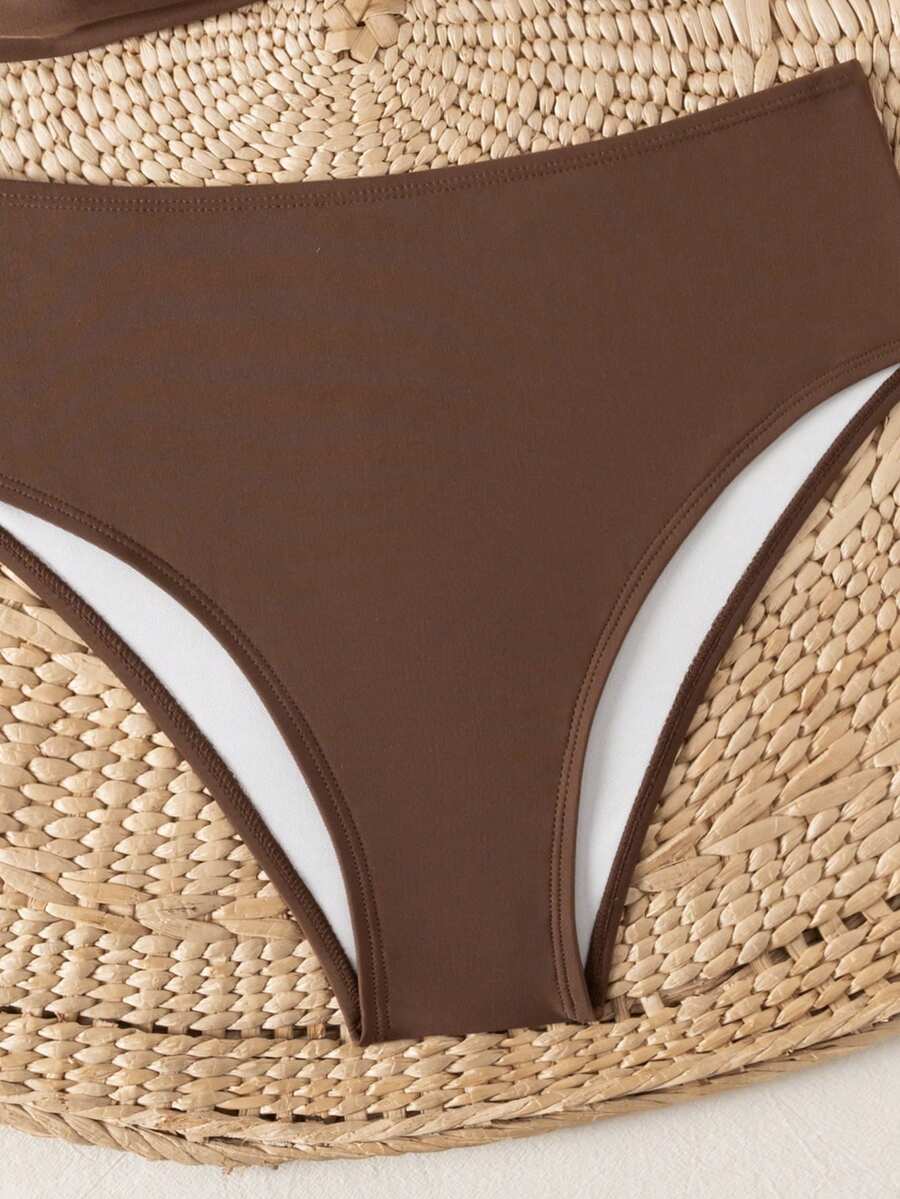 Springbreak black high waist bikini set for women featuring wireless bra top with ruffle lettuce trim and V-wired detail.