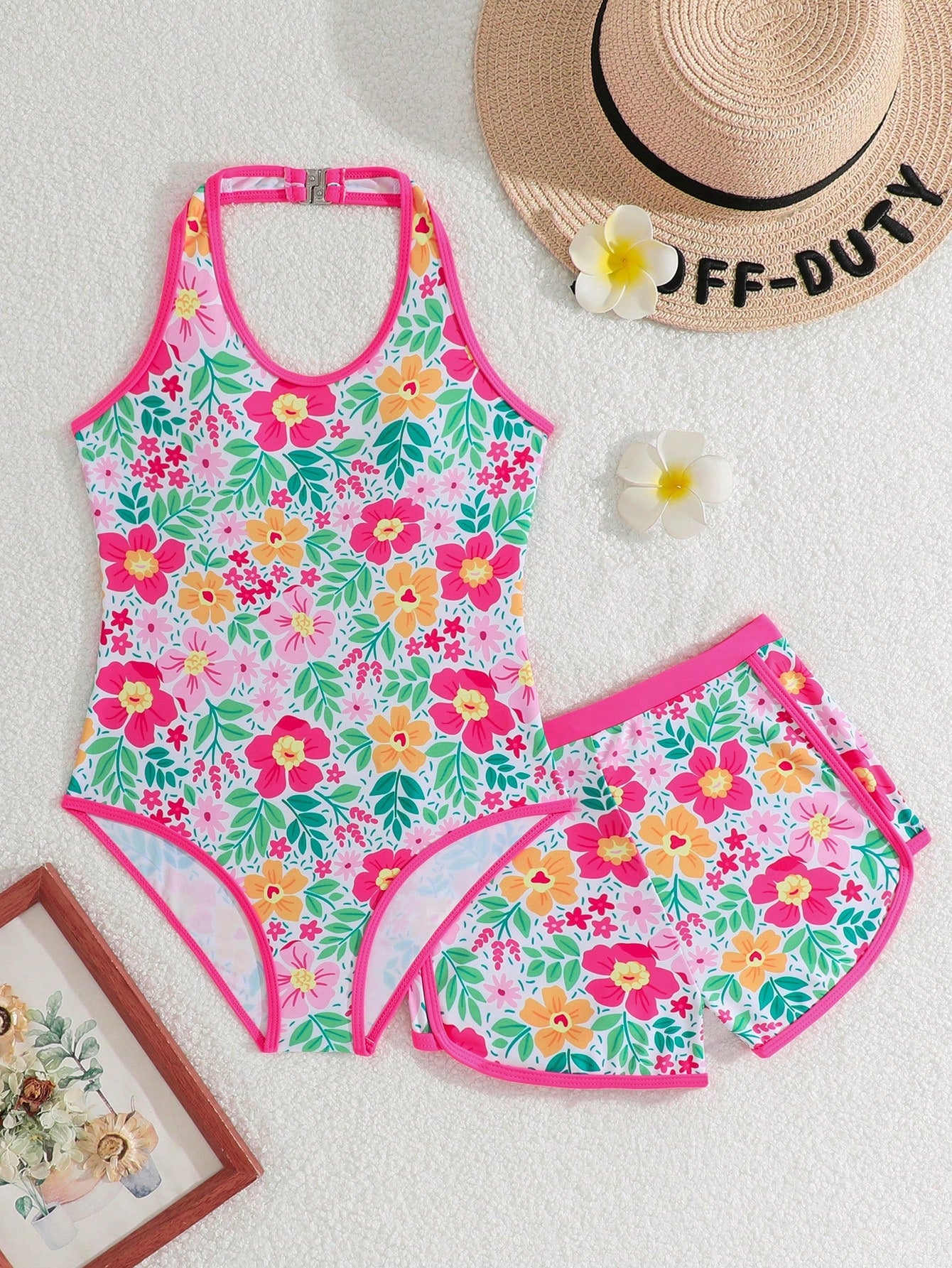 Girls 2-piece swimwear set featuring a butterfly print halter swimsuit top with contrast piping and separate mid-waist shorts; sleeveless, high-stretch, wireless design for beach and vacation wear.