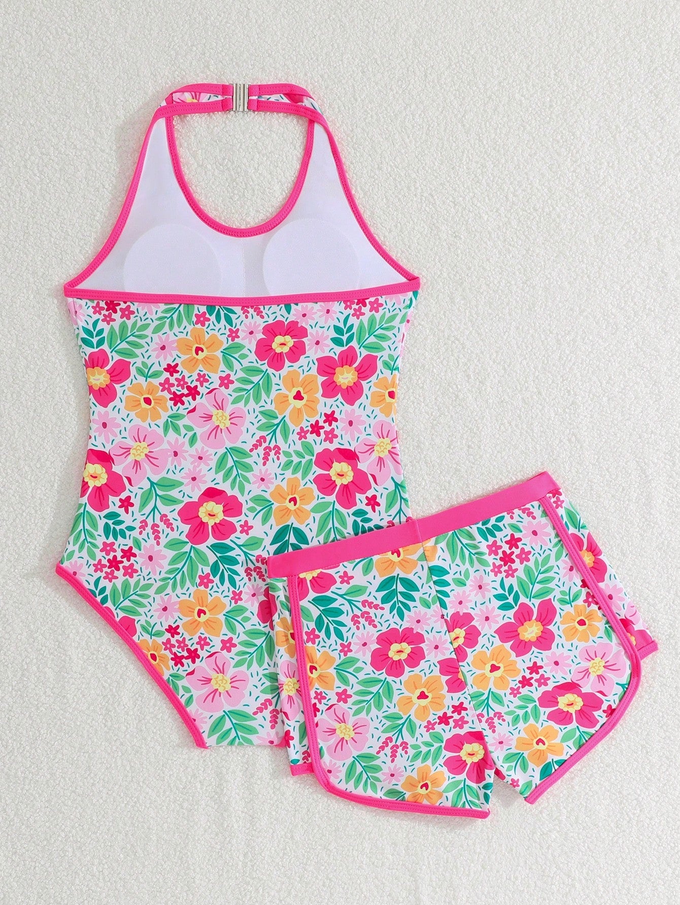 Girls 2-piece swimwear set featuring a butterfly print halter swimsuit top with contrast piping and separate mid-waist shorts; sleeveless, high-stretch, wireless design for beach and vacation wear.