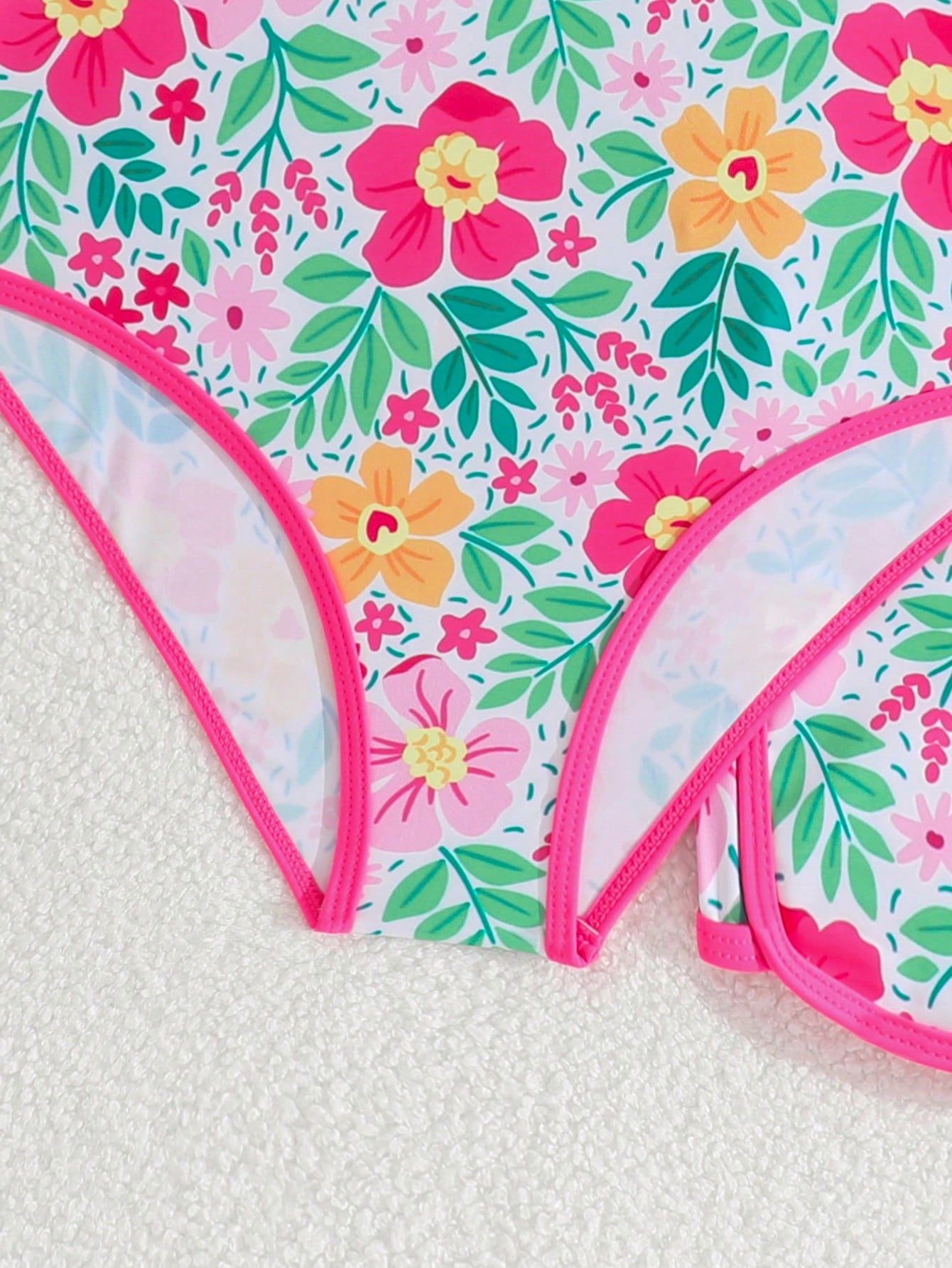 Girls 2-piece swimwear set featuring a butterfly print halter swimsuit top with contrast piping and separate mid-waist shorts; sleeveless, high-stretch, wireless design for beach and vacation wear.
