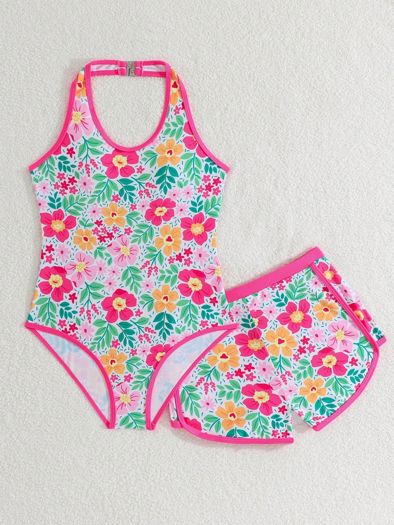 Girls 2-piece swimwear set featuring a butterfly print halter swimsuit top with contrast piping and separate mid-waist shorts; sleeveless, high-stretch, wireless design for beach and vacation wear.
